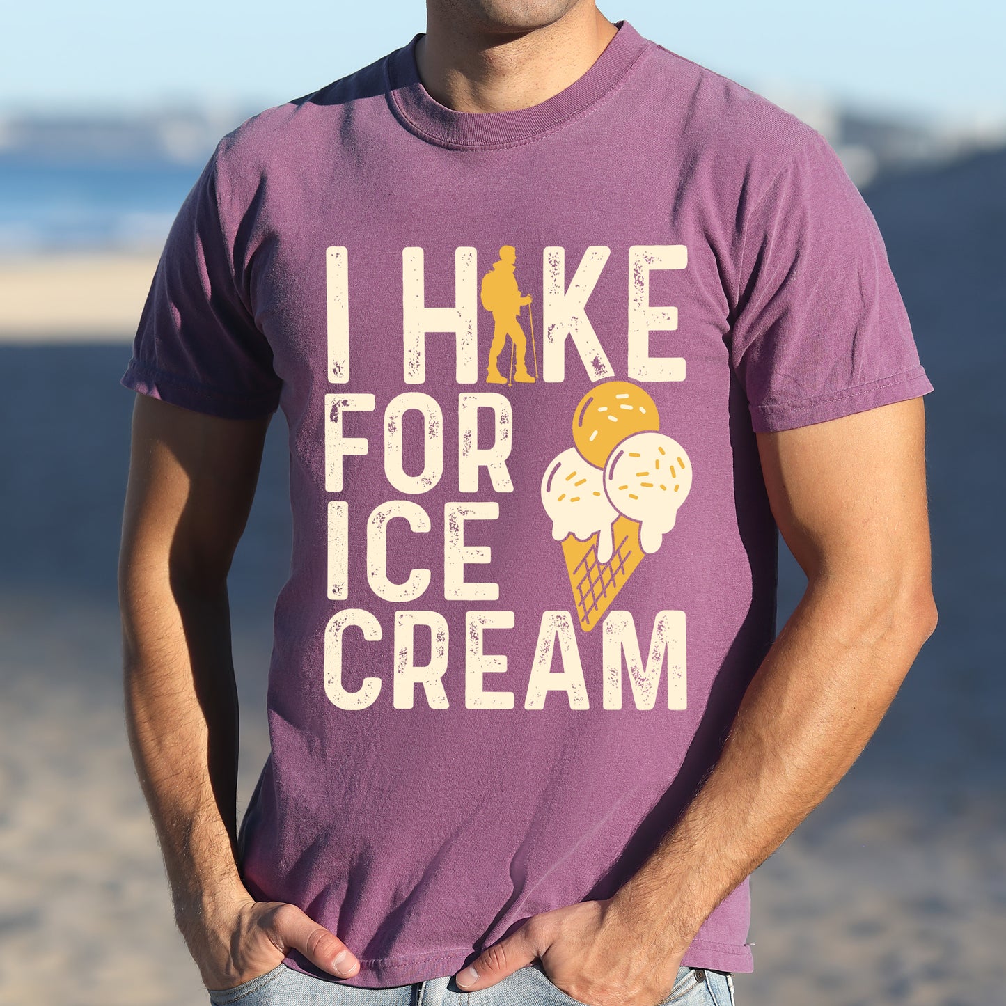 Berry (Dark Violet) graphic t-shirt with 'I Hike for Ice Cream' text in cream lettering featuring orange hiker silhouette and vanilla and mango ice cream cone illustration with waffle cone.