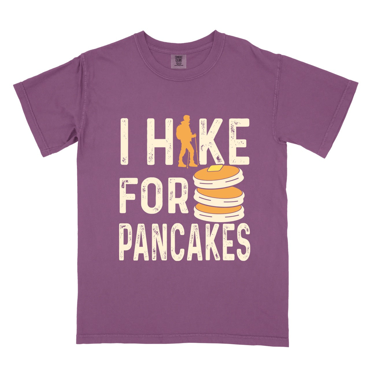 Berry (purple) Pancake breakfast lover vintage tee I Hike for Pancakes with distressed cream typography character silhouette with trekking pole and illustrated stacked pancakes with butter on Comfort Colors shirt for brunch and food enthusiasts, hikers and foodies.