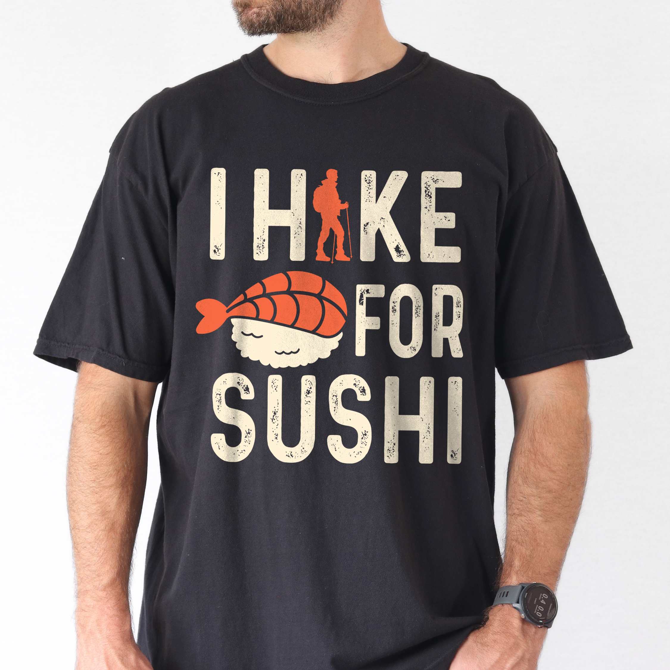 Man wearing black 'I Hike for Sushi' text in cream lettering, illustrated shrimp sushi, and backpacker for sushi lovers