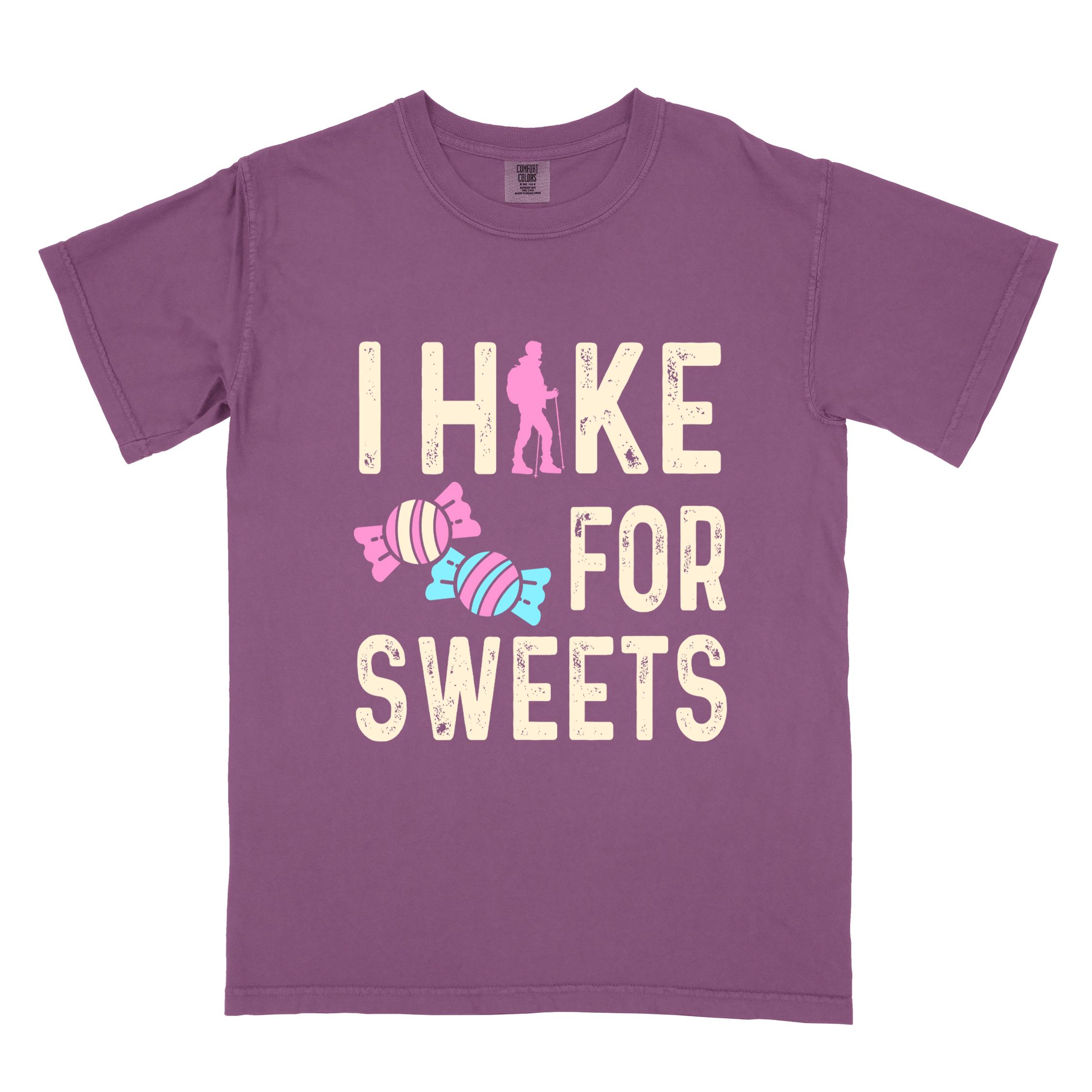 Berry 'I Hike for Sweets' text in cream lettering, illustrated pieces of candies, and backpacker for candy lovers