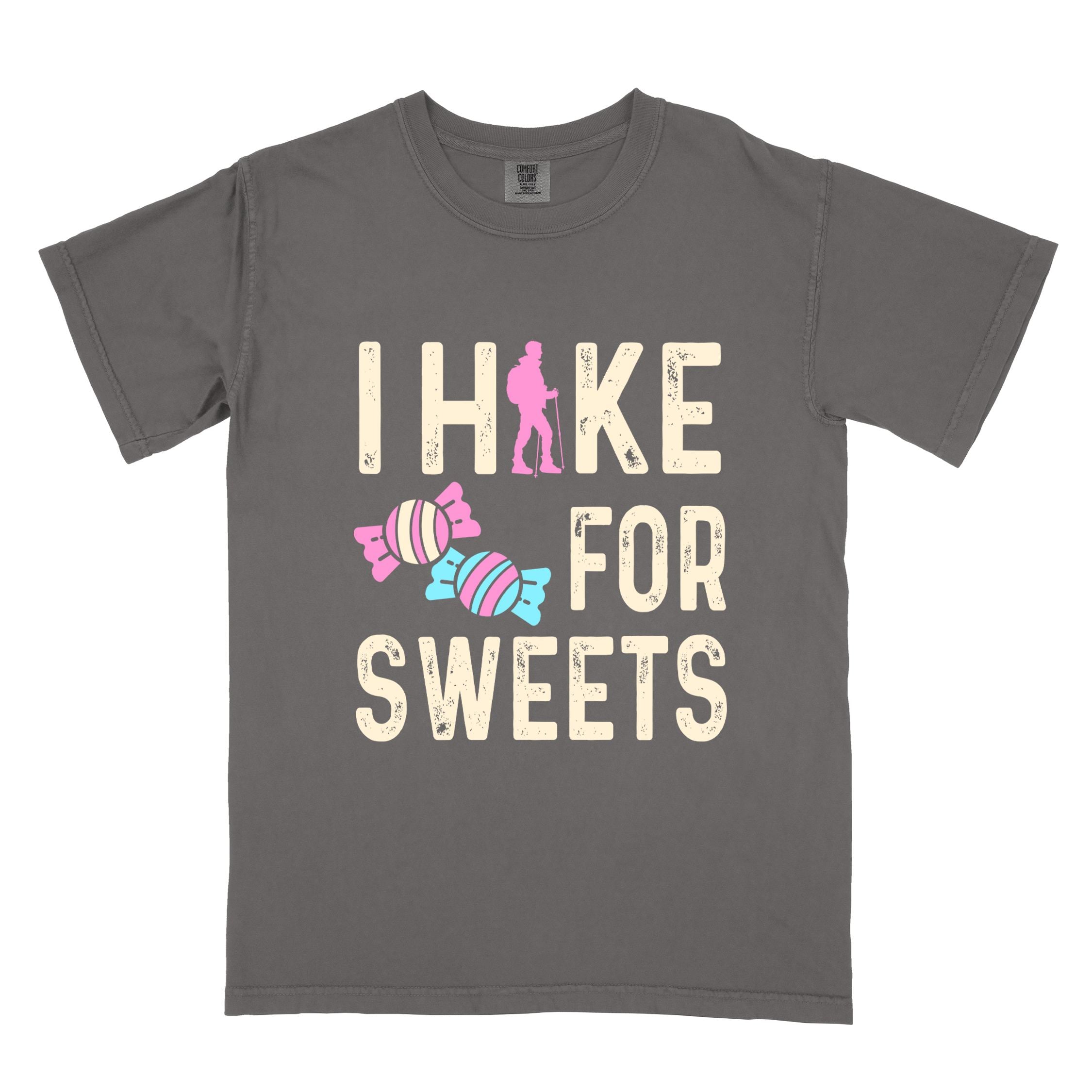 Pepper 'I Hike for Sweets' text in cream lettering, illustrated pieces of candies, and backpacker for candy lovers
