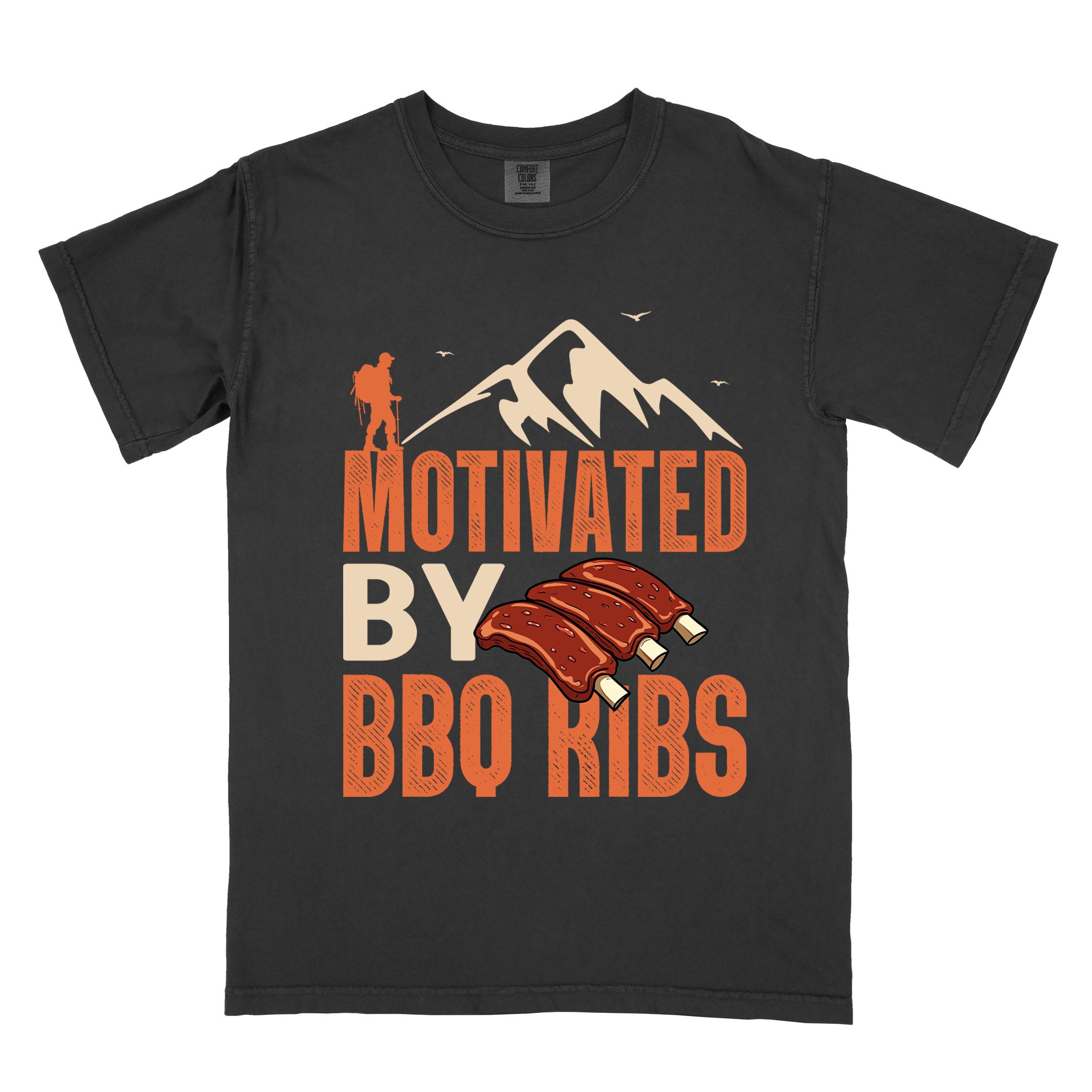 Black "Motivated by BBQ ribs" colored vintage tee with bold typography, mountains, juicy grilled bbq ribs illustration, and backpacker for bbq enthusiasts