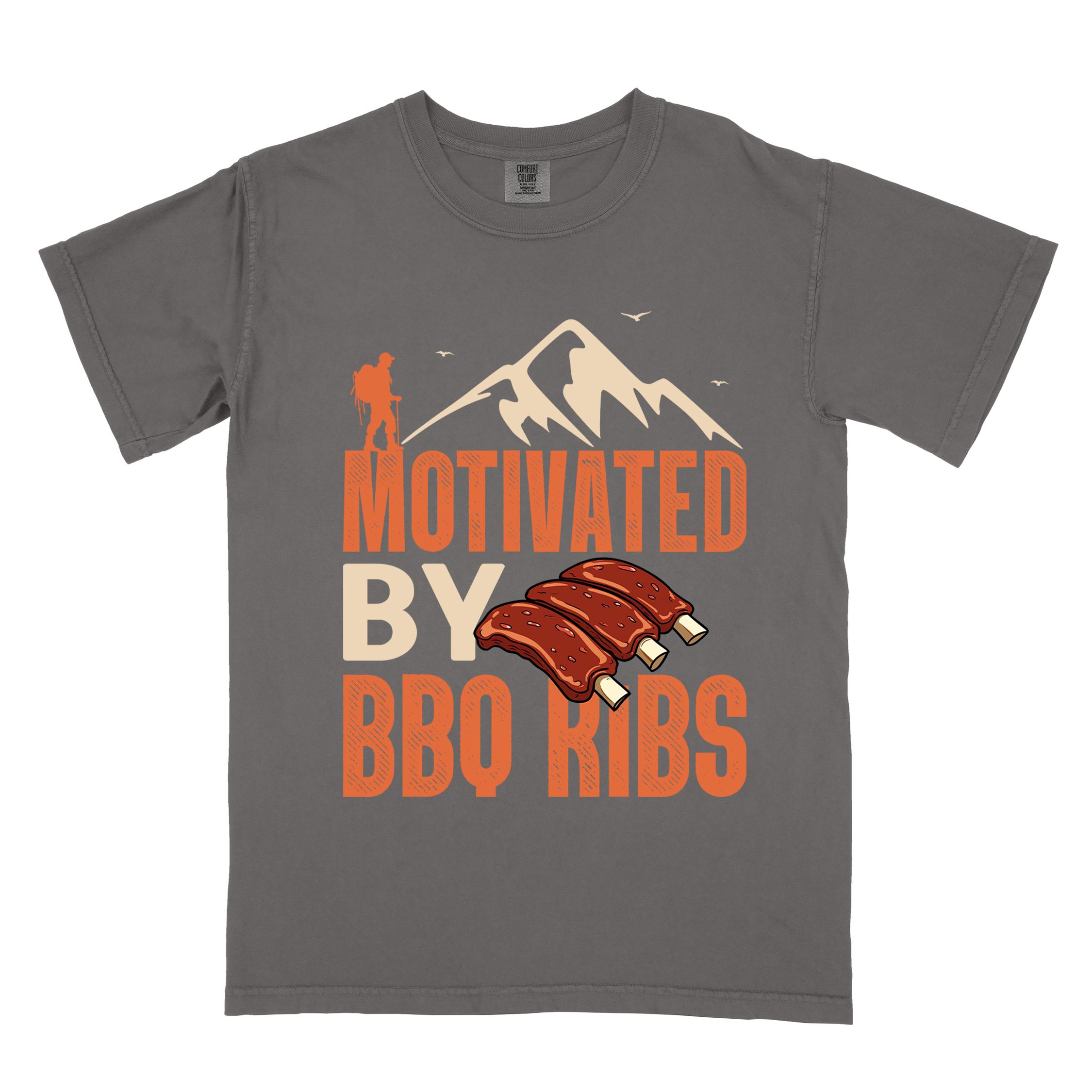 Pepper "Motivated by BBQ ribs" colored vintage tee with bold typography, mountains, juicy grilled bbq ribs illustration, and backpacker for bbq enthusiasts