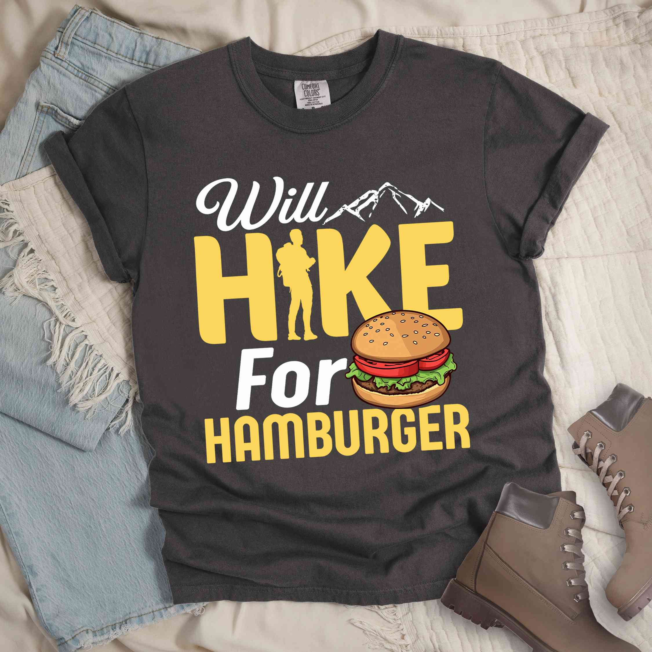 Pepper "Will Hike for Hamburger" colored vintage tee with bold typography, birds, mountains, illustrated juicy hamburger, and backpacker for burger enthusiasts.