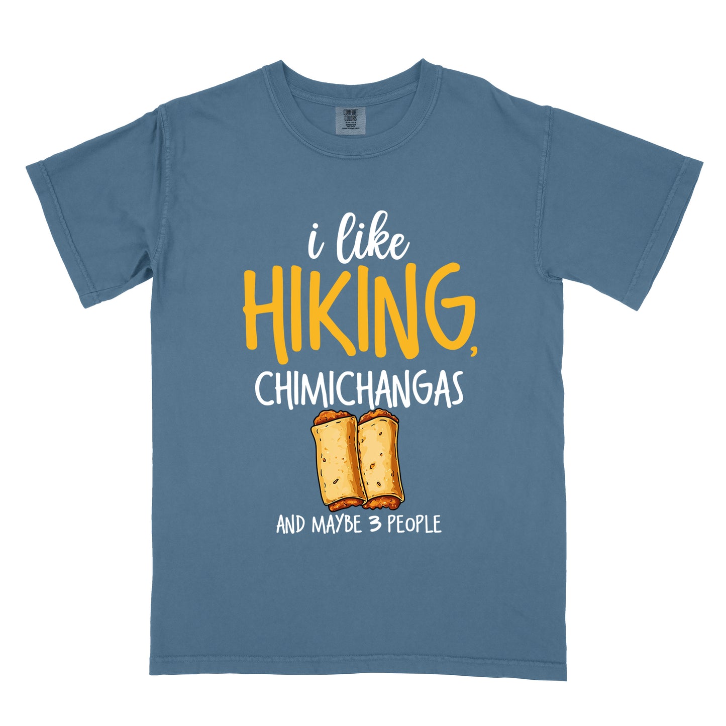 Blue Jean (Denim Blue) t-shirt with text "i like HIKING, CHIMICHANGAS AND MAYBE 3 PEOPLE". The phrase "i like" appears in white script at the top, "HIKING," in yellow letters, "CHIMICHANGAS" in white, and "AND MAYBE 3 PEOPLE" in white at the bottom. Between "CHIMICHANGAS" and "AND MAYBE 3 PEOPLE" is an illustration of two chimichangas (fried burritos) with visible fillings. The design combines hiking, food, and introvert humor.