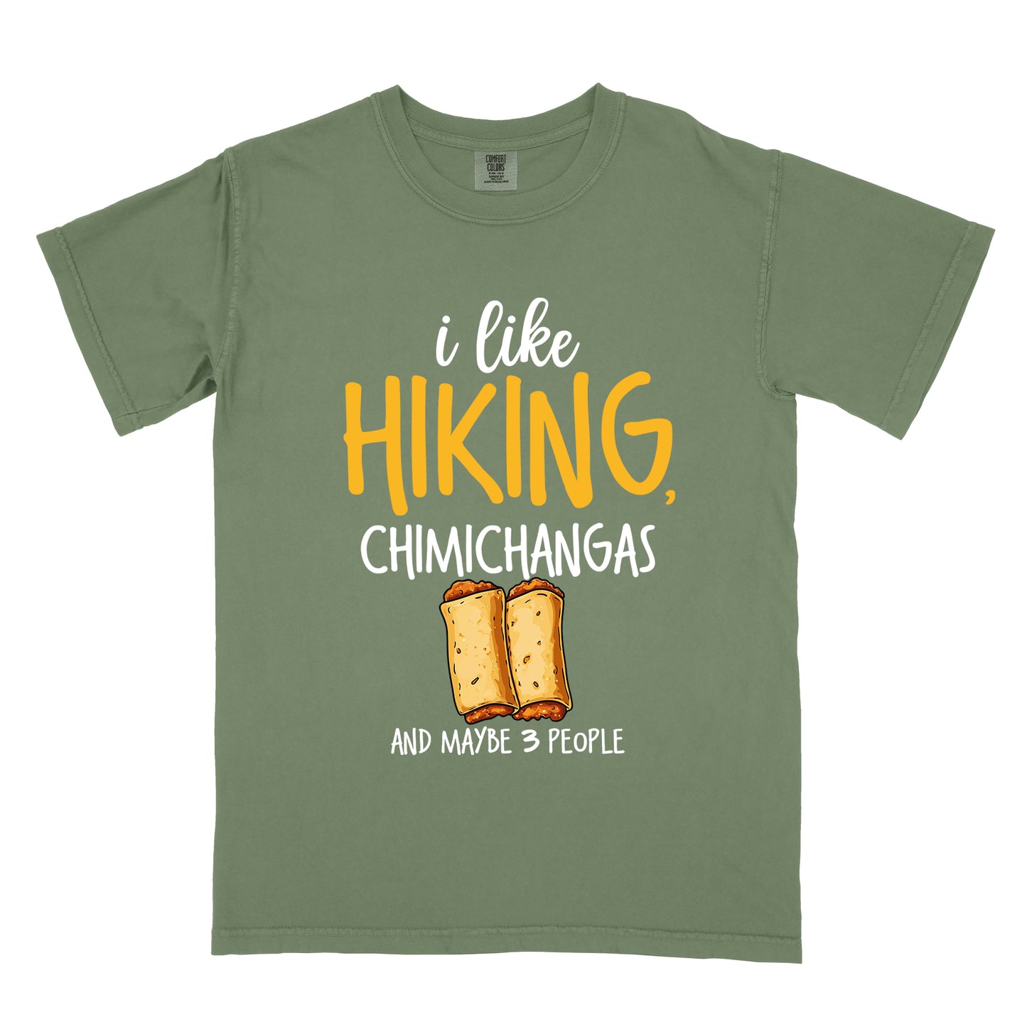 Moss (Dark Green) t-shirt with text "i like HIKING, CHIMICHANGAS AND MAYBE 3 PEOPLE". The phrase "i like" appears in white script at the top, "HIKING," in yellow letters, "CHIMICHANGAS" in white, and "AND MAYBE 3 PEOPLE" in white at the bottom. Between "CHIMICHANGAS" and "AND MAYBE 3 PEOPLE" is an illustration of two chimichangas (fried burritos) with visible fillings. The design combines hiking, food, and introvert humor.