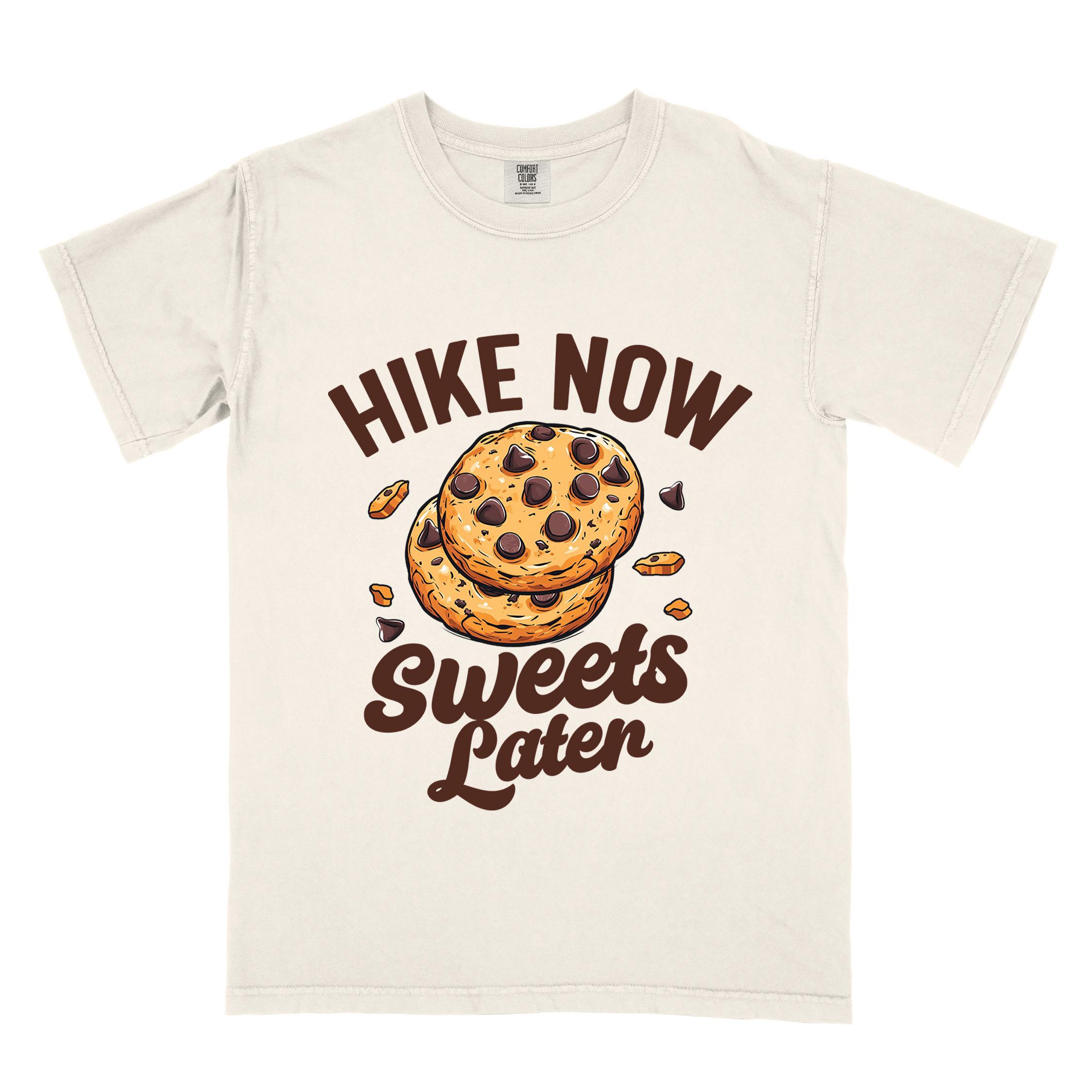 Ivory “Hike Now Sweets Later” colored vintage tee with bold and script typography, illustration of chocolate chip cookies with crumbs scattered around. Perfect for cookie lovers.
