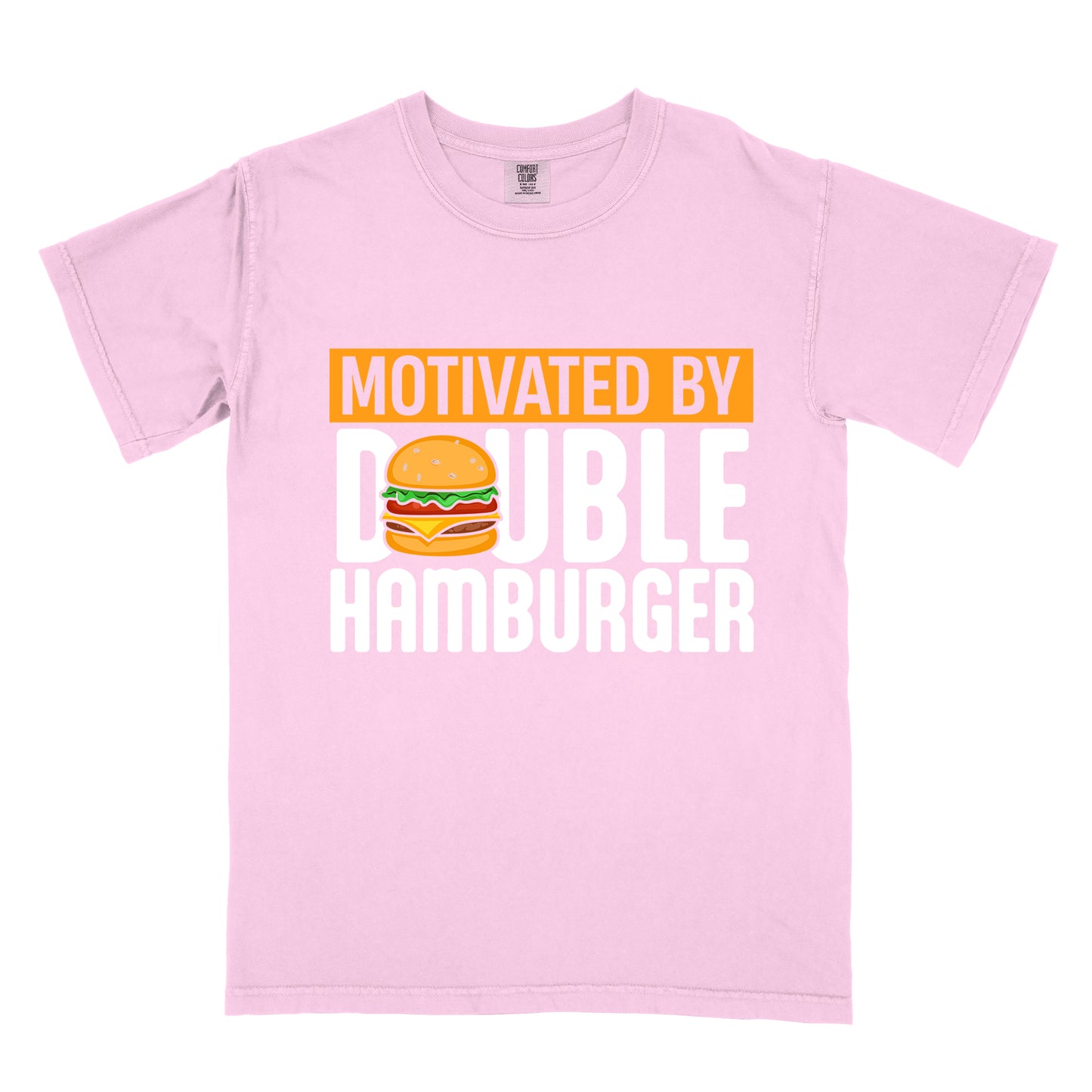 Blossom (Light Pink) t-shirt with text "MOTIVATED BY DOUBLE HAMBURGER". "MOTIVATED BY" appears in Blossom (Light Pink) text on an orange rectangular background at the top. "DOUBLE HAMBURGER" appears in large white letters below, with a colorful hamburger illustration replacing the letter "O" in "DOUBLE". The hamburger graphic shows a sesame seed bun, lettuce, tomato, cheese, and beef patty.