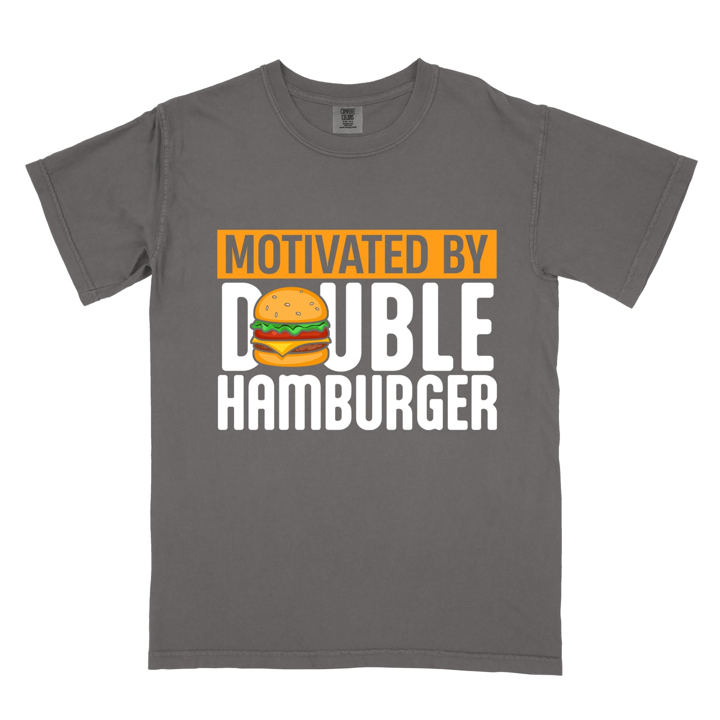 Pepper (Dark Gray) t-shirt with text "MOTIVATED BY DOUBLE HAMBURGER". "MOTIVATED BY" appears in Pepper (Dark Gray) text on an orange rectangular background at the top. "DOUBLE HAMBURGER" appears in large white letters below, with a colorful hamburger illustration replacing the letter "O" in "DOUBLE". The hamburger graphic shows a sesame seed bun, lettuce, tomato, cheese, and beef patty.