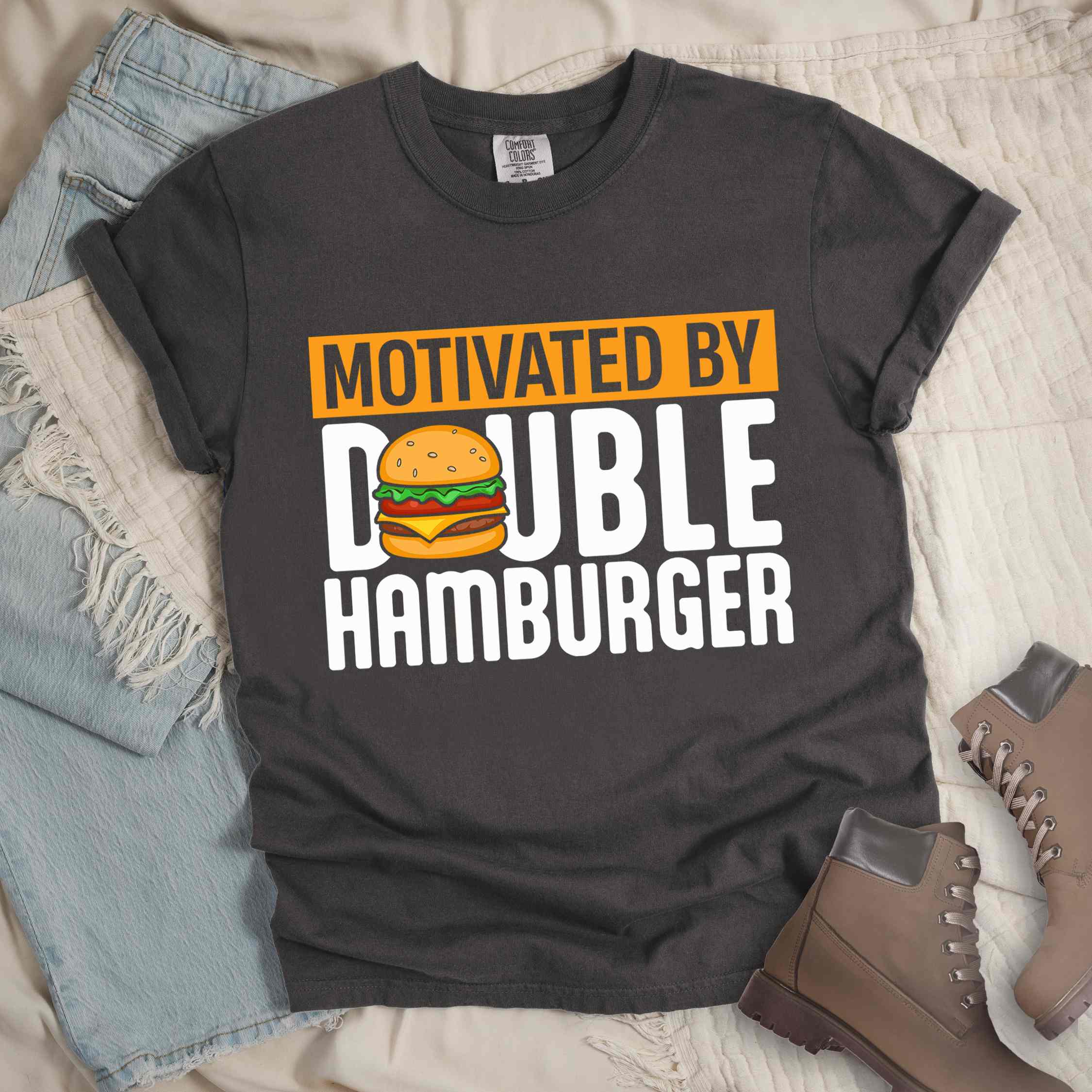 Pepper "Motivated by Double Hamburger" colored vintage tee with bold typography, illustrated juicy hamburger, and backpacker for burger enthusiasts.