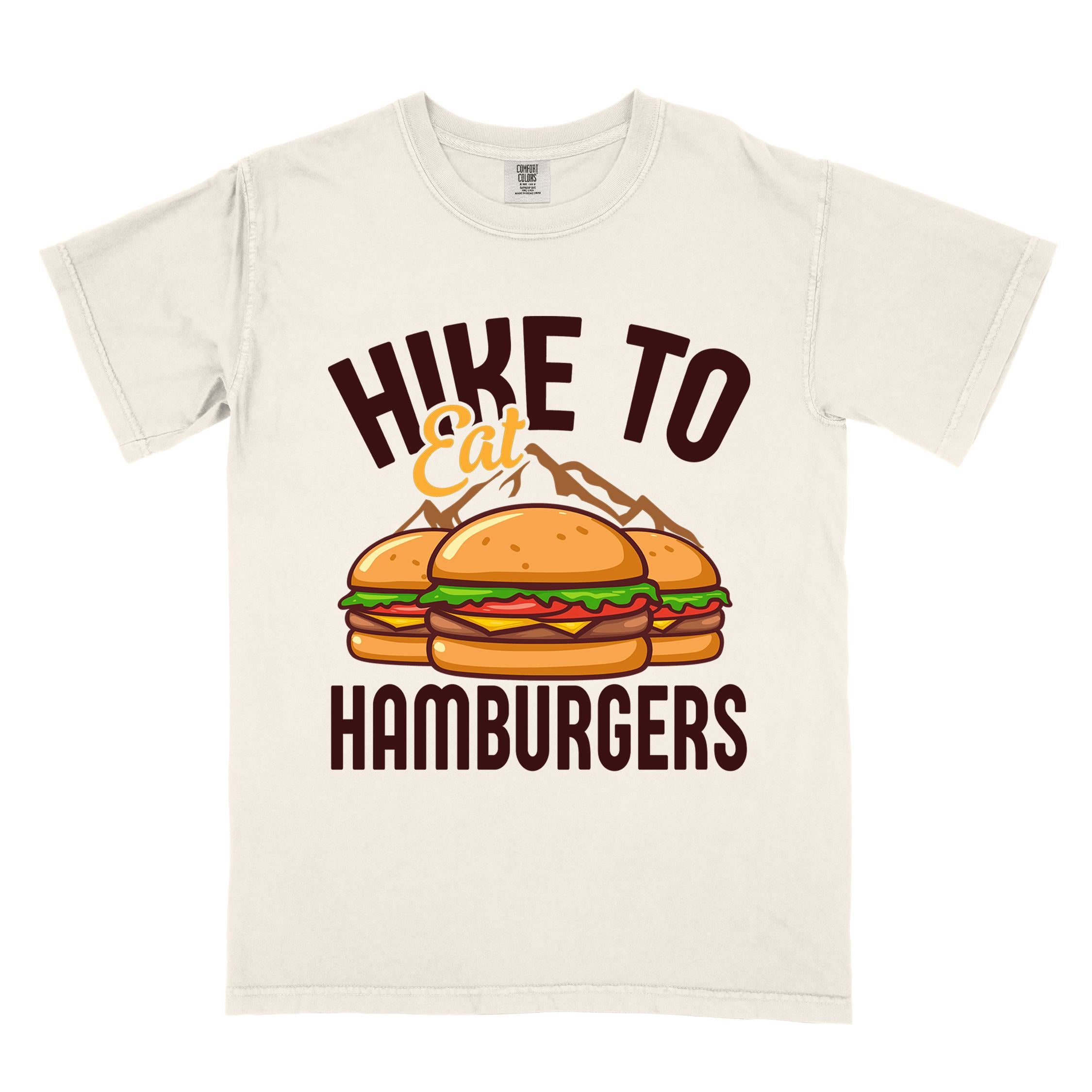 Ivory "Hike to Eat Hamburgers" colored vintage tee with bold typography, illustrated juicy hamburger, and backpacker for burger enthusiasts.