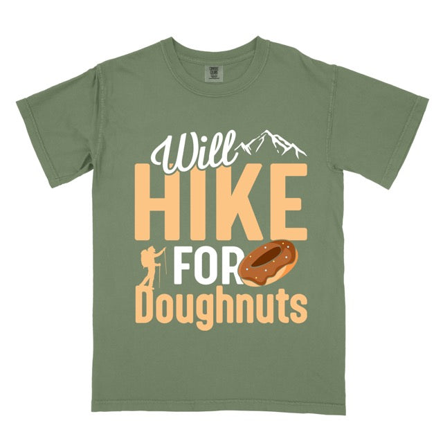 Moss (Green) Will Hike for Doughnuts statement t-shirt featuring chocolate doughnut graphic, mountain peaks, and hiker silhouette for doughnut lovers and outdoor enthusiasts on Comfort Colors 1717