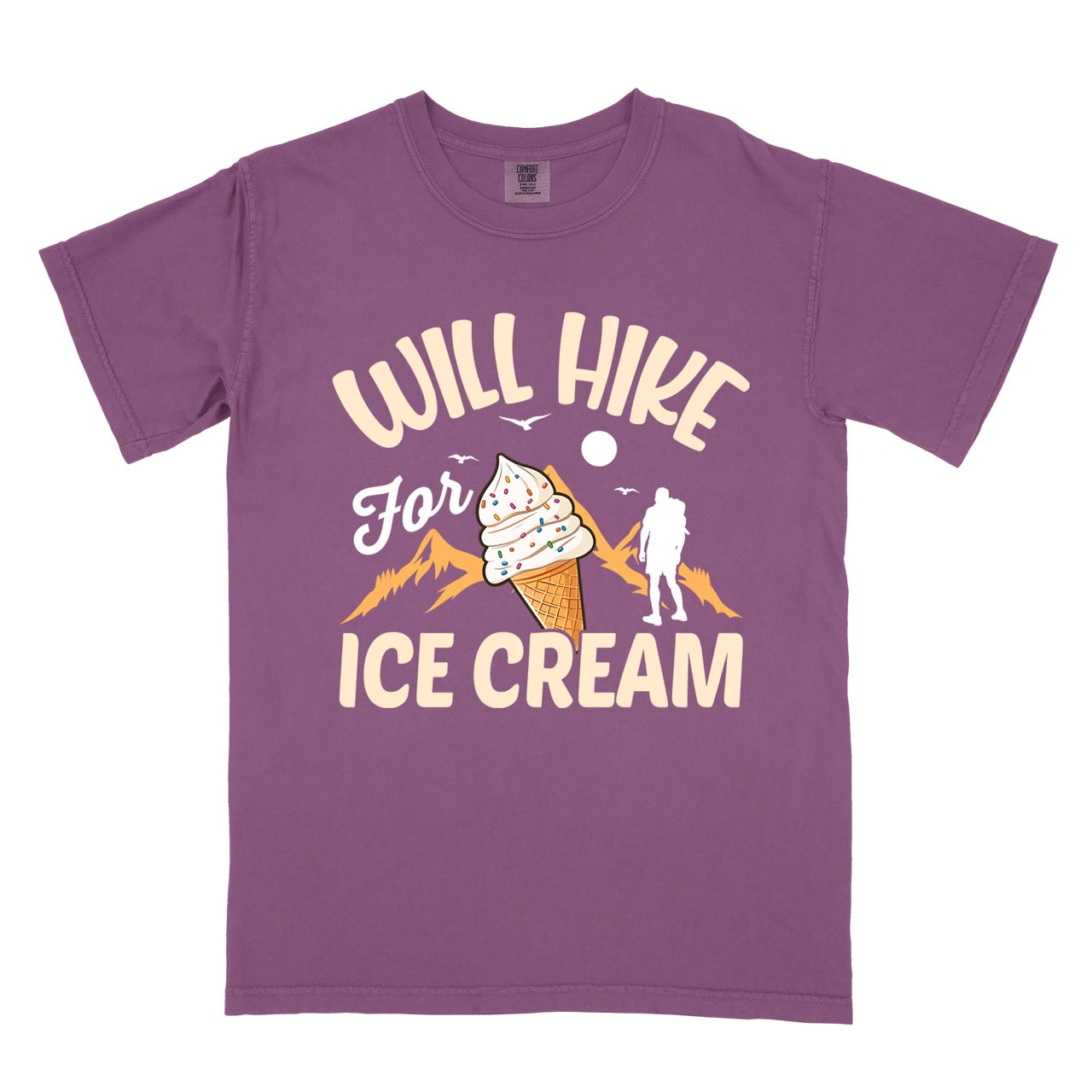 Berry (purple) Will Hike for Ice Cream statement tee with curved typography, script lettering, mountain peaks, hiker silhouette, and ice cream cone illustration on Comfort Colors shirt for dessert-loving outdoor enthusiasts