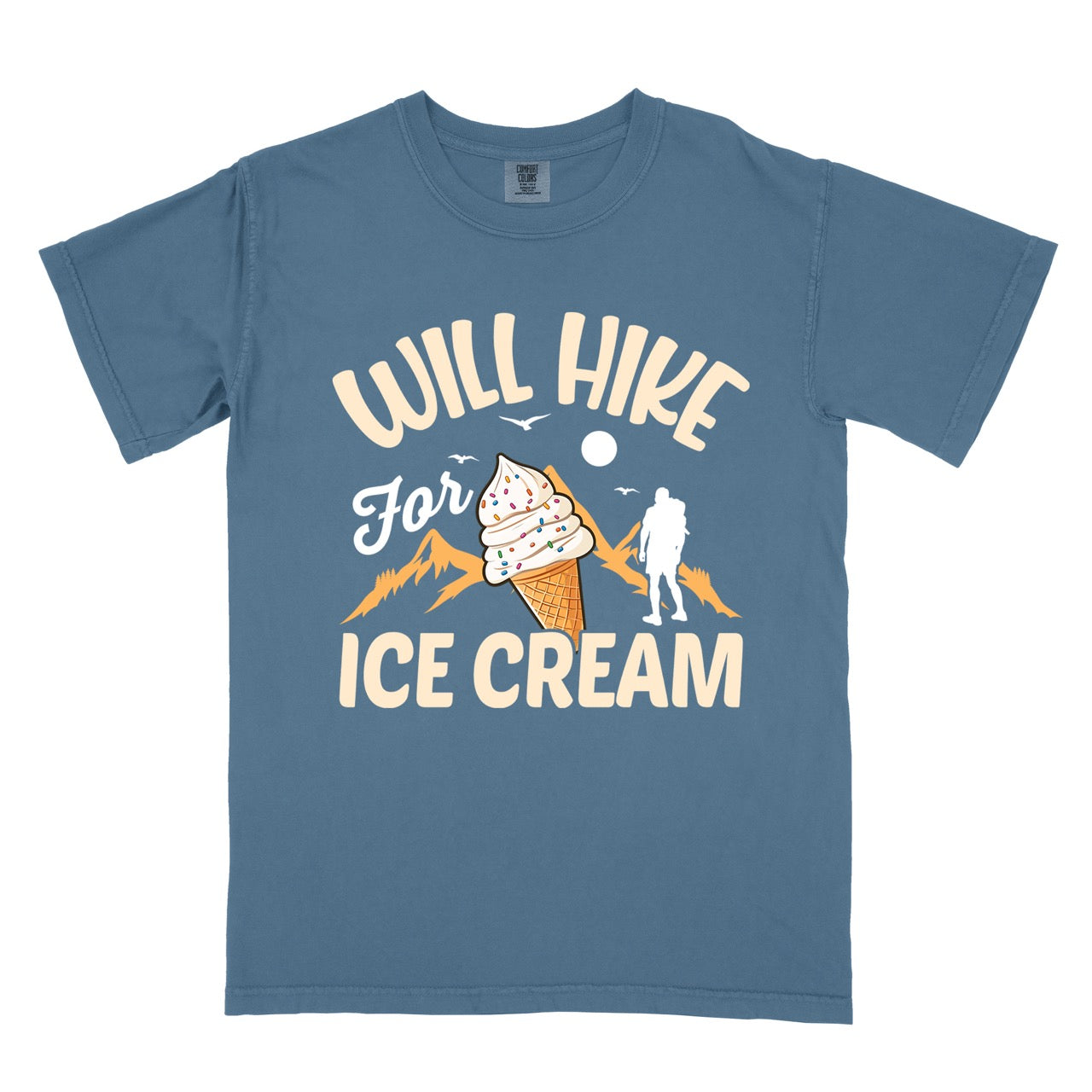 Blue Jean (blue) Will Hike for Ice Cream statement tee with curved typography, script lettering, mountain peaks, hiker silhouette, and ice cream cone illustration on Comfort Colors shirt for dessert-loving outdoor enthusiasts