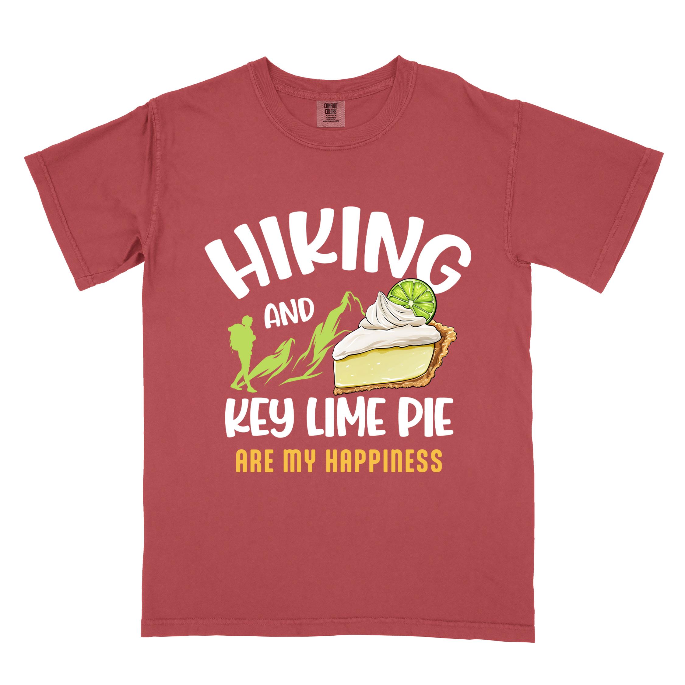 Crimson "Hiking and key lime pie are my happiness" colored vintage tee with bold typography, mountains, birds, illustrated slice of key lime pie, and backpacker for pie lovers.