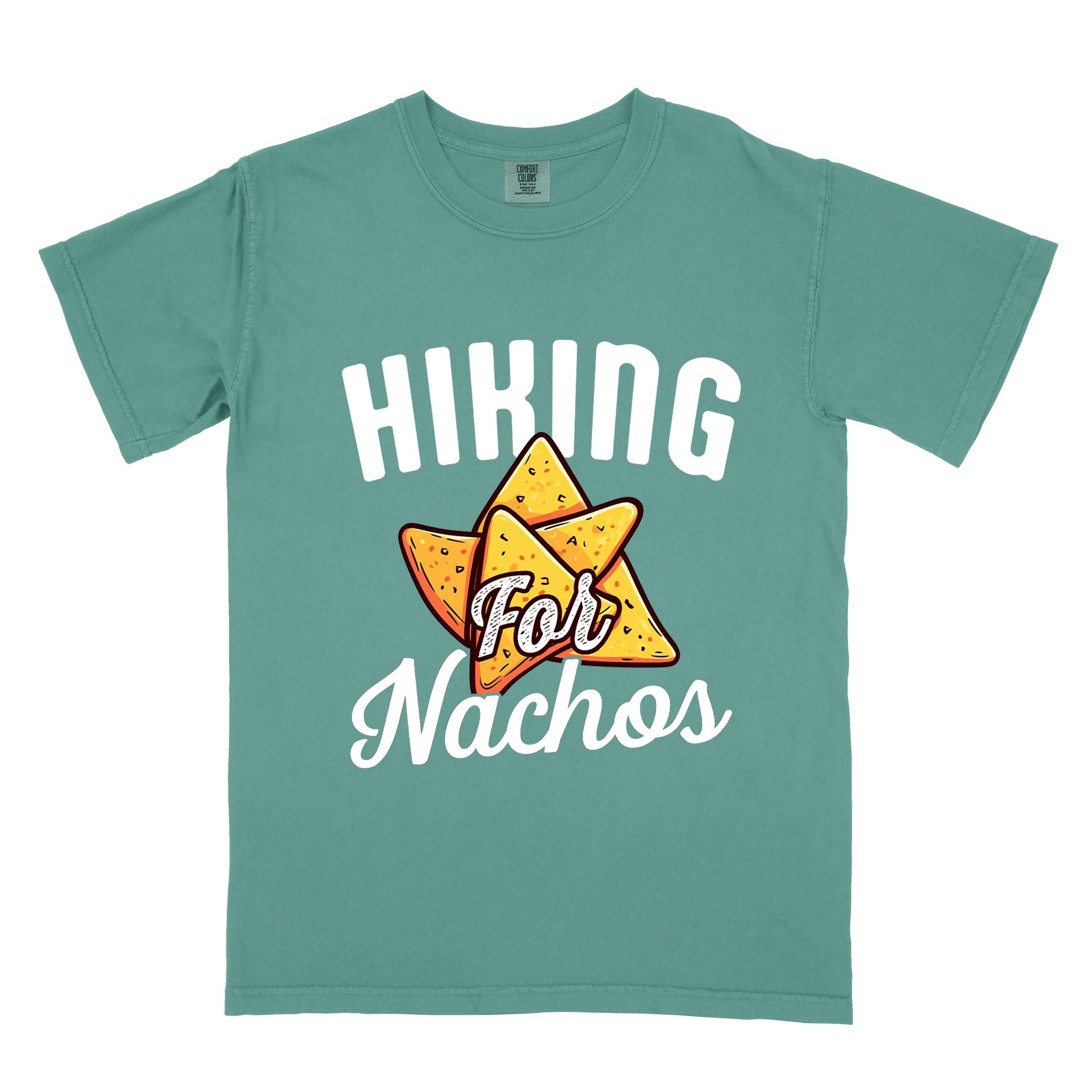 Light green "Hiking for Nachos" colored vintage tee with bold typography, illustrated crispy nachos chips, and backpacker craving for chips.