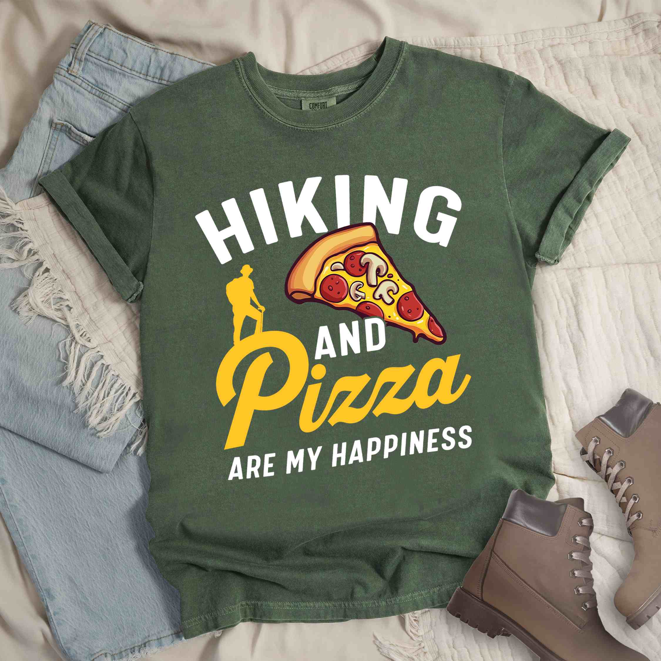 Moss "Hiking and Pizza are my happiness" colored vintage tee with bold typography, birds, mountains, illustrated pizza slice, and backpacker for pizza lovers.