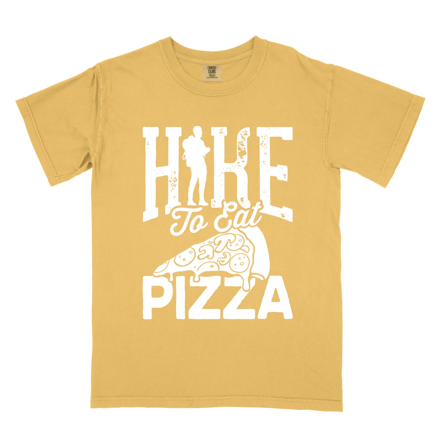 Mustard (Yellow) t-shirt with white distressed text reading "HIKE To Eat PIZZA". "HIKE" appears in large block letters at the top with a silhouette of a hiker with backpack integrated into the "I", "To Eat" in script in the middle, and "PIZZA" in large block letters at the bottom. Features a simple line drawing of a pizza slice with toppings between the phrases. The design humorously connects hiking activity with pizza as a reward.