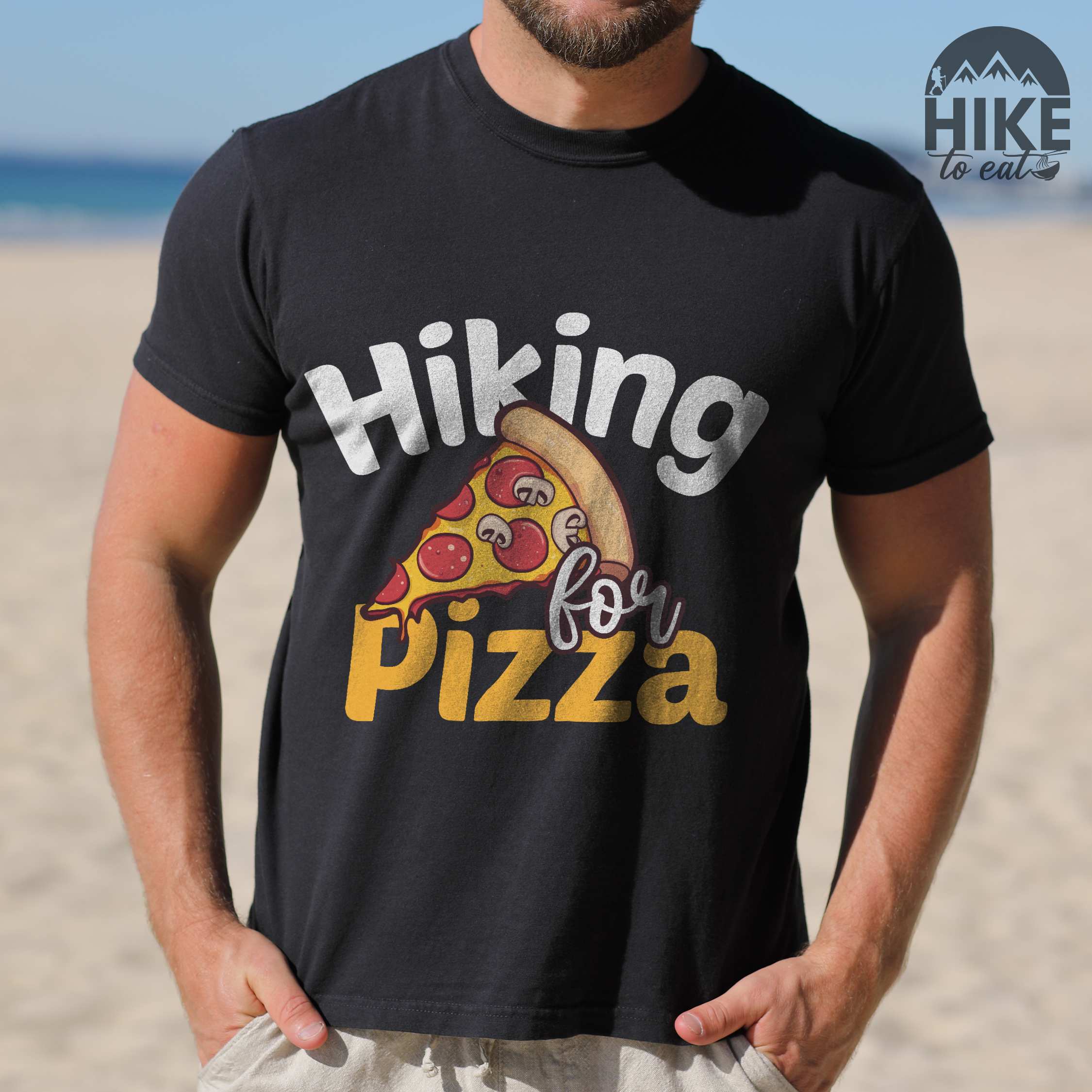 Man wearing lback "Hiking for pizza" colored vintage tee with bold typography, illustrated pizza slice, and backpacker for pizza lover.