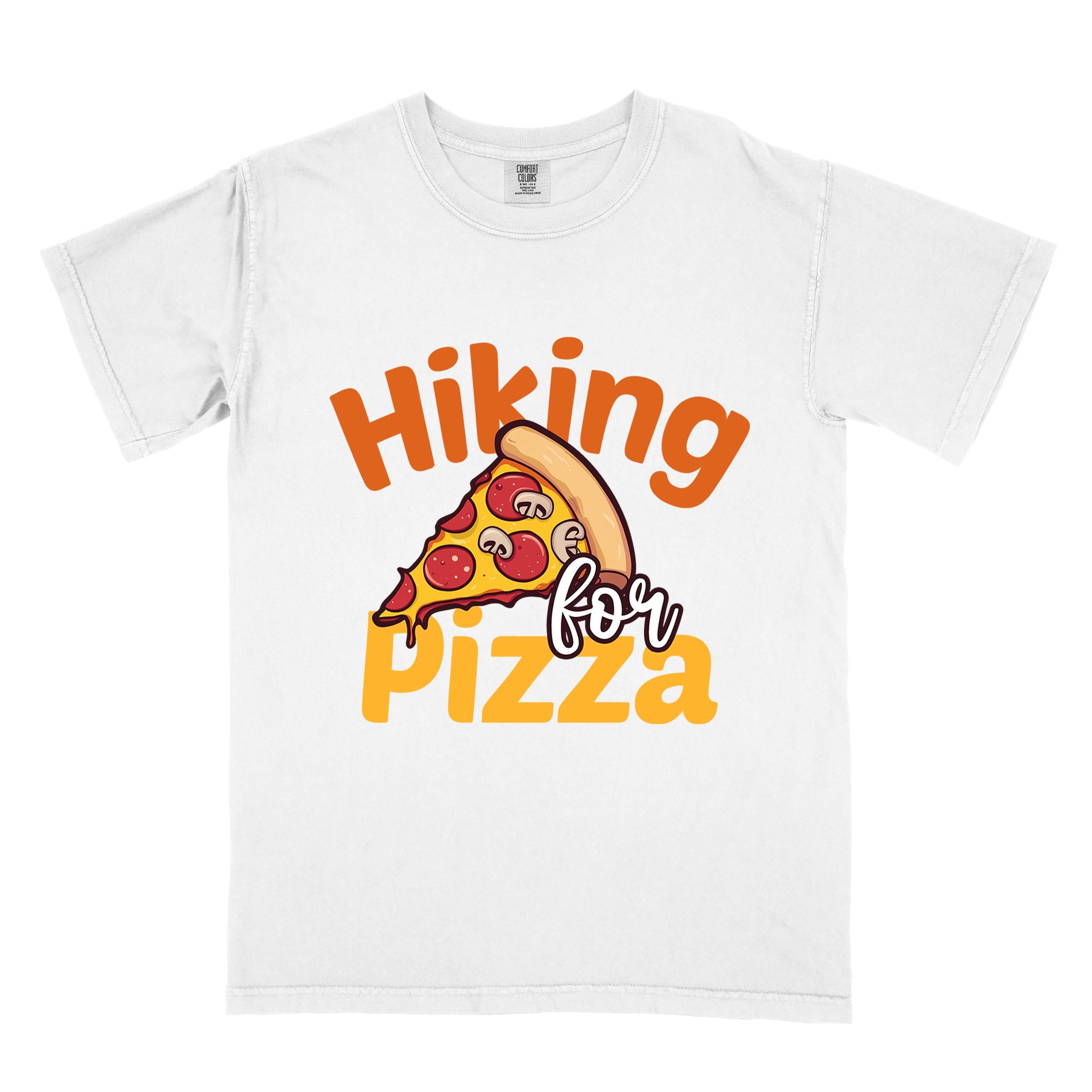 White "Hiking for pizza" colored vintage tee with bold typography, illustrated pizza slice, and backpacker for pizza lover.