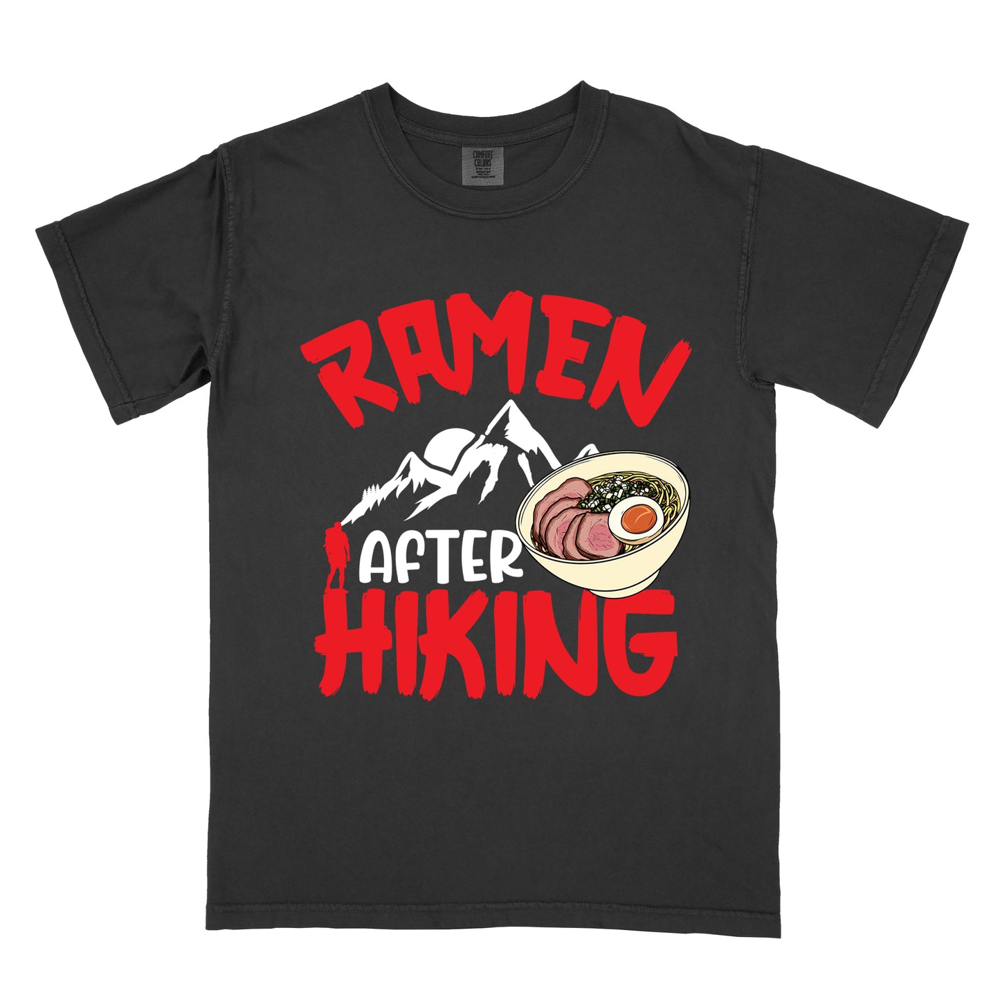 Black t-shirt with red text reading "RAMEN AFTER HIKING". "RAMEN" appears in bold red letters at the top, "AFTER" in white in the middle, and "HIKING" in bold red at the bottom. Features white mountain silhouettes in the center with a red hiker figure, and a detailed illustration of a ramen bowl with sliced meat, egg, and green onions on the right. The design connects outdoor activities with food rewards.