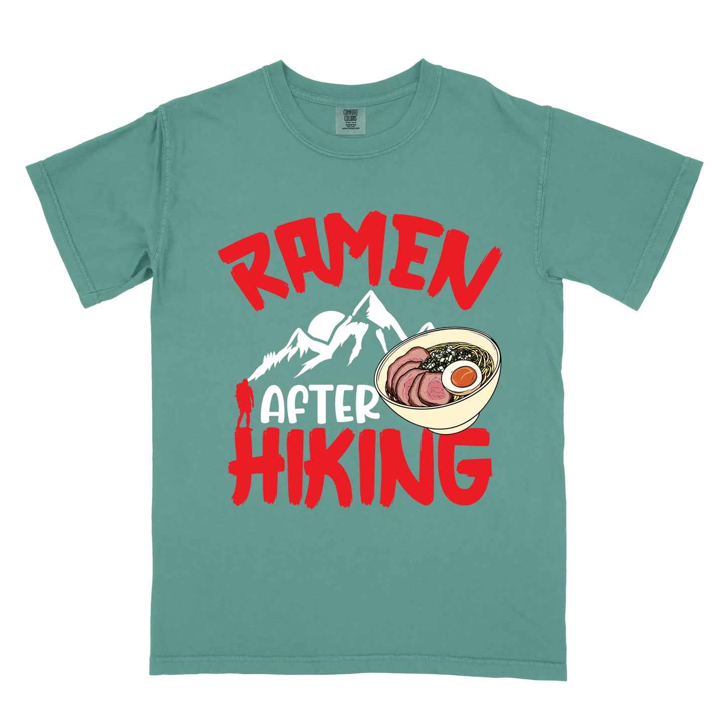 Light Green t-shirt with red text reading "RAMEN AFTER HIKING". "RAMEN" appears in bold red letters at the top, "AFTER" in white in the middle, and "HIKING" in bold red at the bottom. Features white mountain silhouettes in the center with a red hiker figure, and a detailed illustration of a ramen bowl with sliced meat, egg, and green onions on the right. The design connects outdoor activities with food rewards.