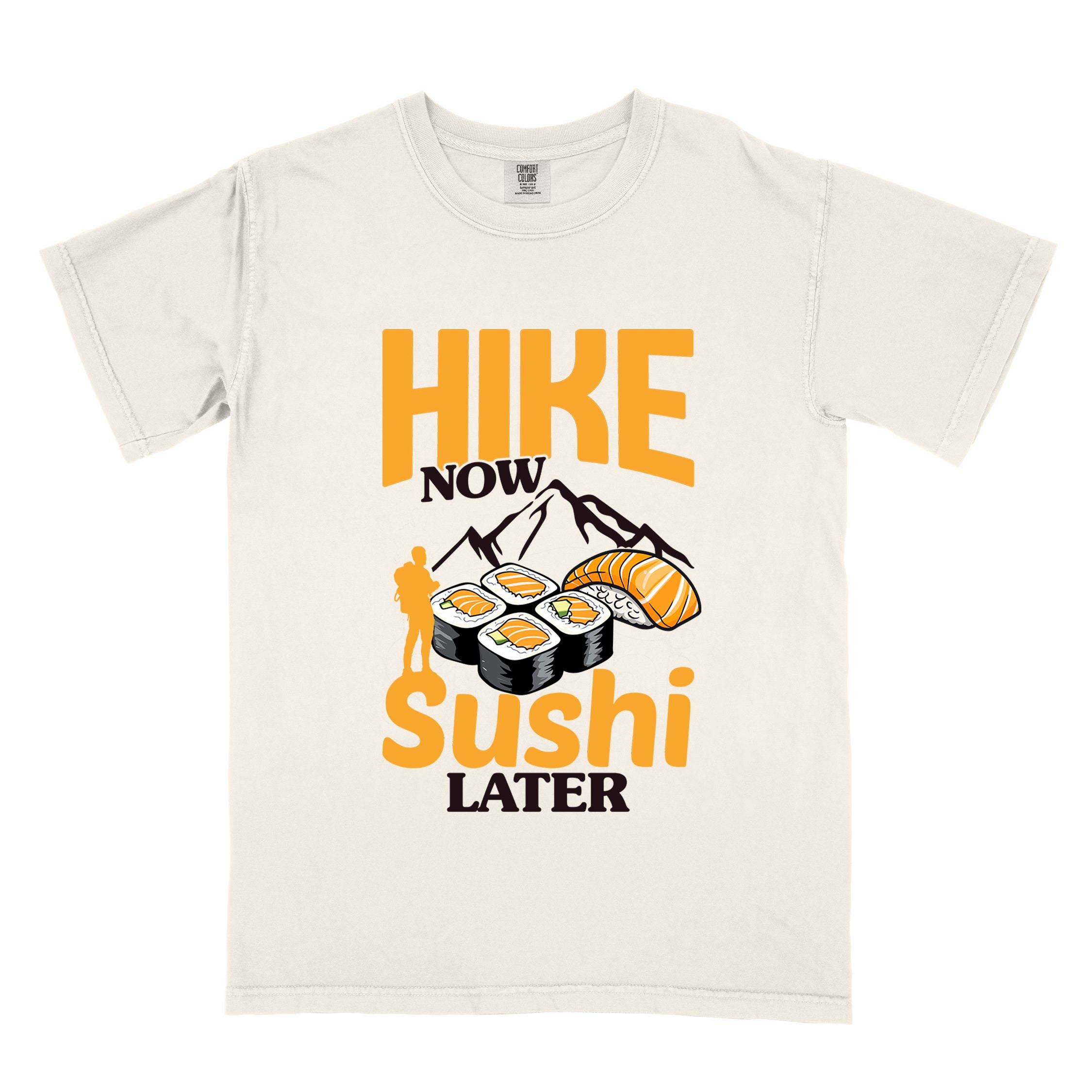 Ivory "Hike now sushi later" colored vintage tee with bold typography, birds, mountains, illustrated sushi platter, and backpacker for sushi lovers.