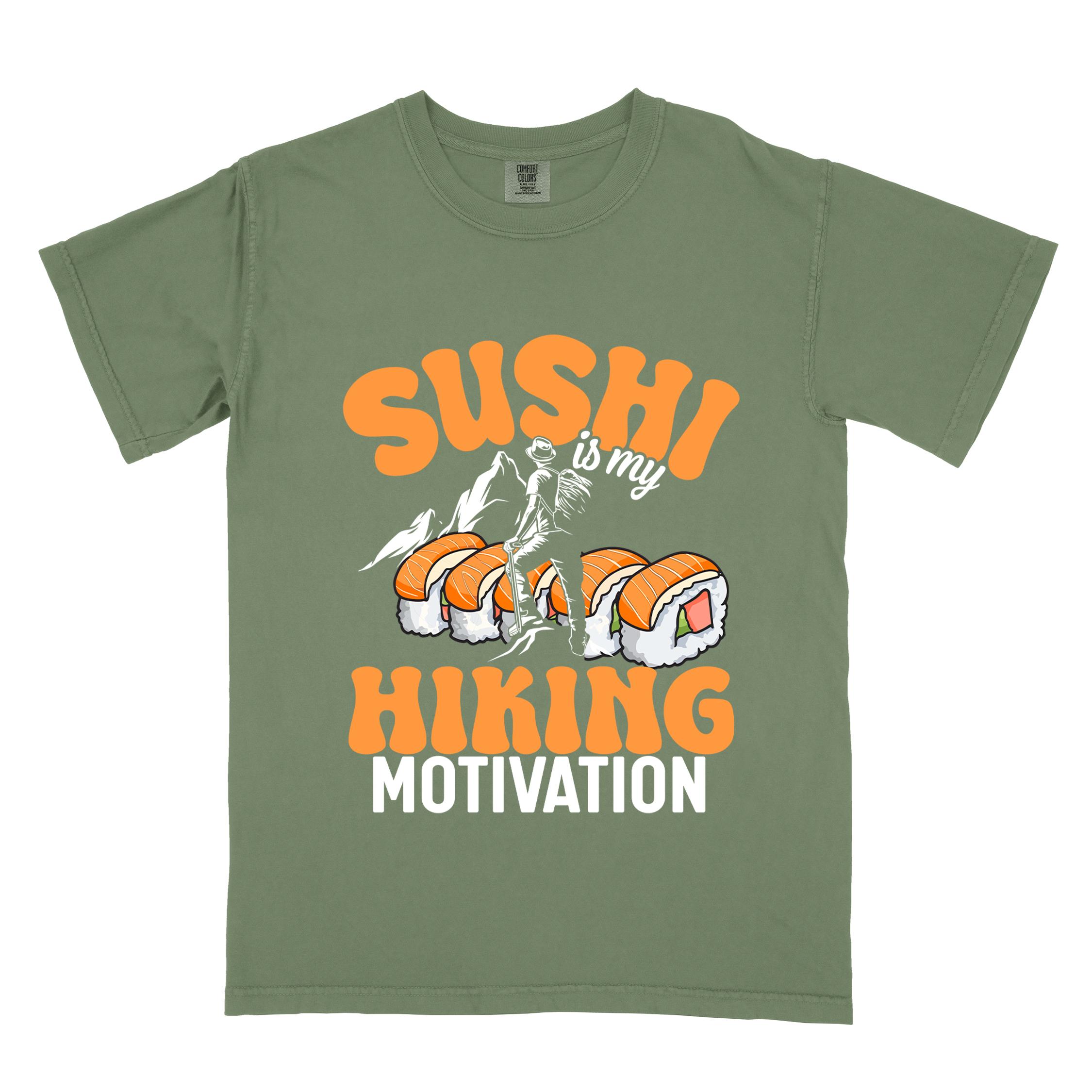 Moss "sushi is my hiking motivation" colored vintage tee with bold typography, birds, mountains, illustrated sushi platter, and backpacker for sushi lovers.