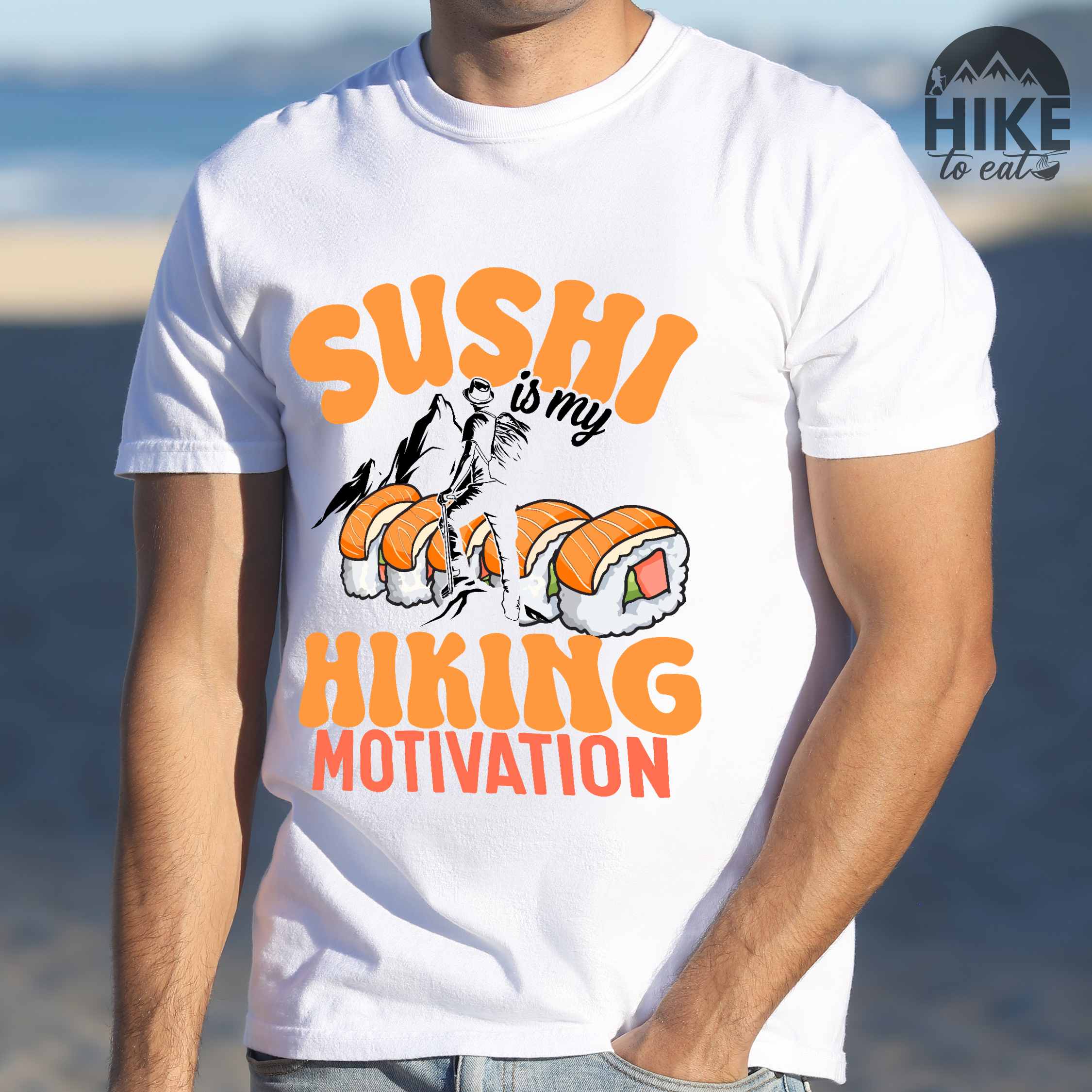 Man wearing white "sushi is my hiking motivation" colored vintage tee with bold typography, birds, mountains, illustrated sushi platter, and backpacker for sushi lovers.