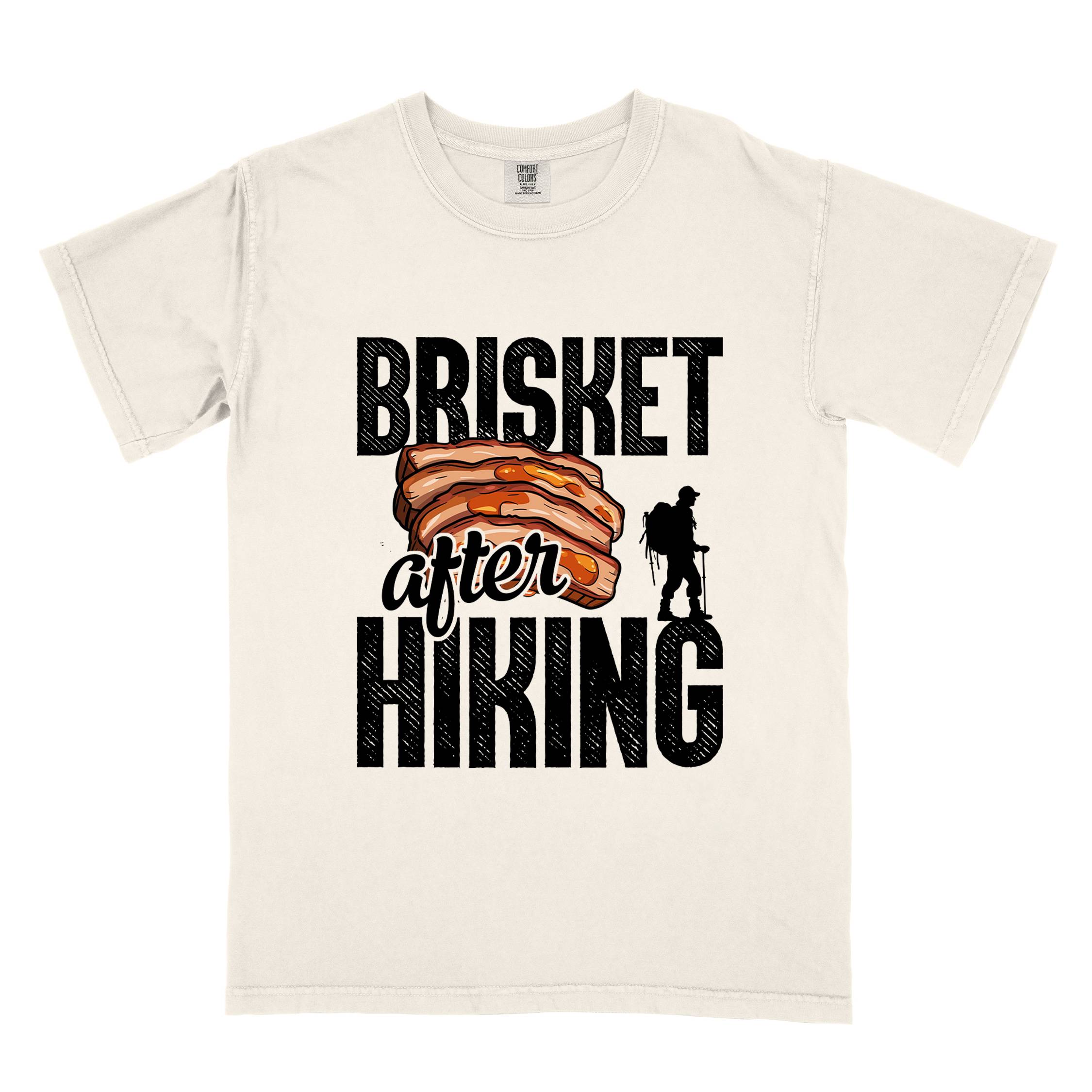 Ivory "Brisket after hiking" colored vintage tee with bold typography, birds, mountains, illustrated bbq beef brisket, and backpacker for bbq lovers.