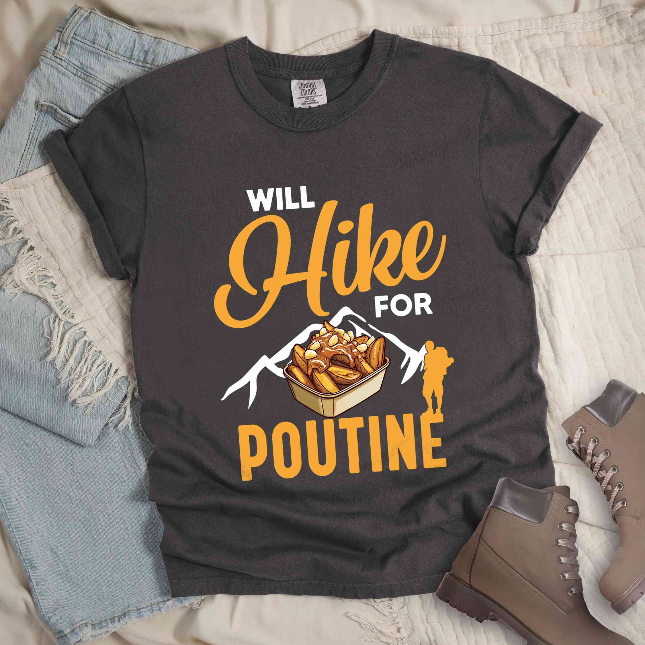 Pepper "Will hike for poutine" colored vintage tee with bold typography, mountains, illustrated a serving of poutine and backpackers looking for comfort food.
