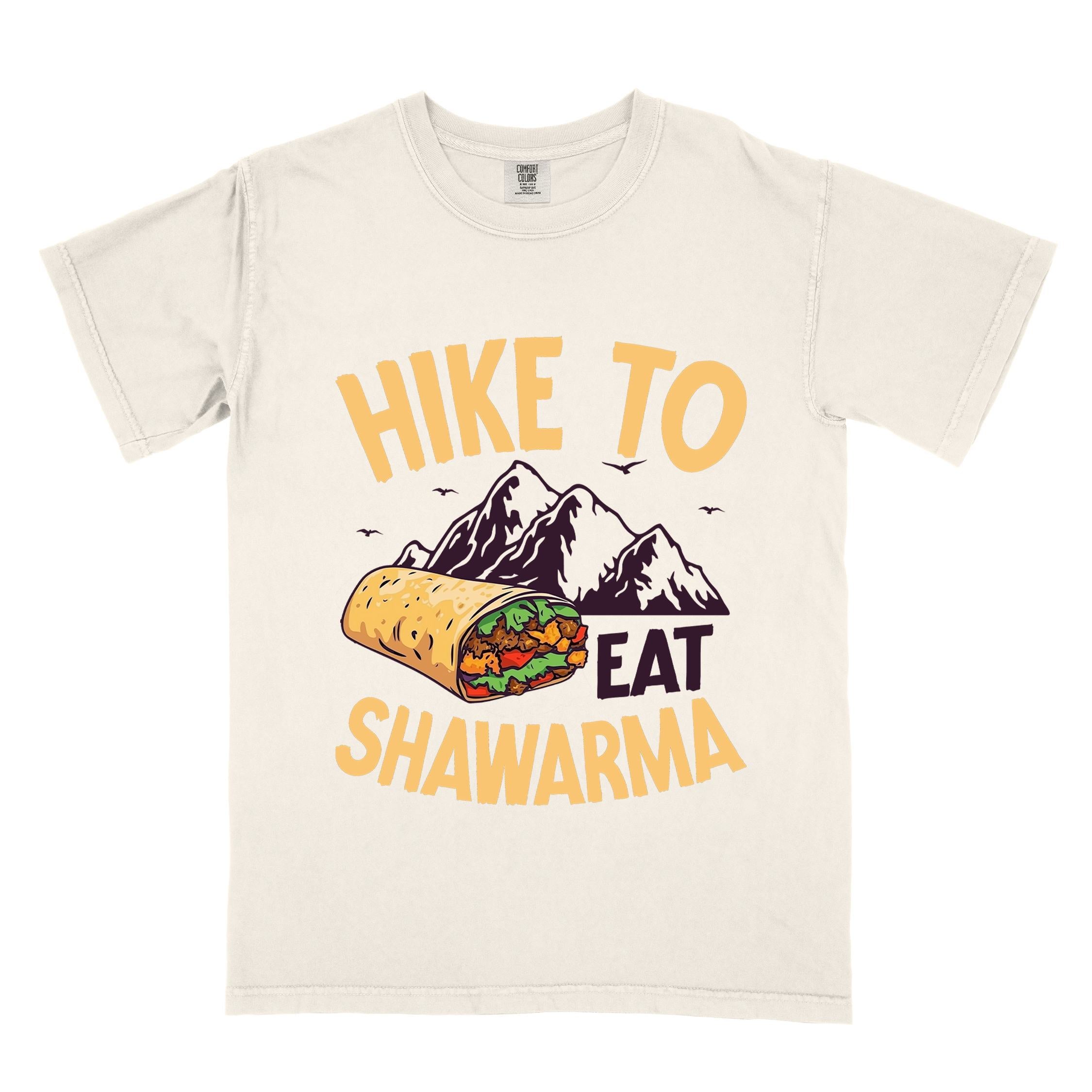 Ivory "Hike to Eat Shawarma" colored vintage tee with bold typography, mountains, birds, and illustrated shawarma, and backpackers for shawarma lovers.