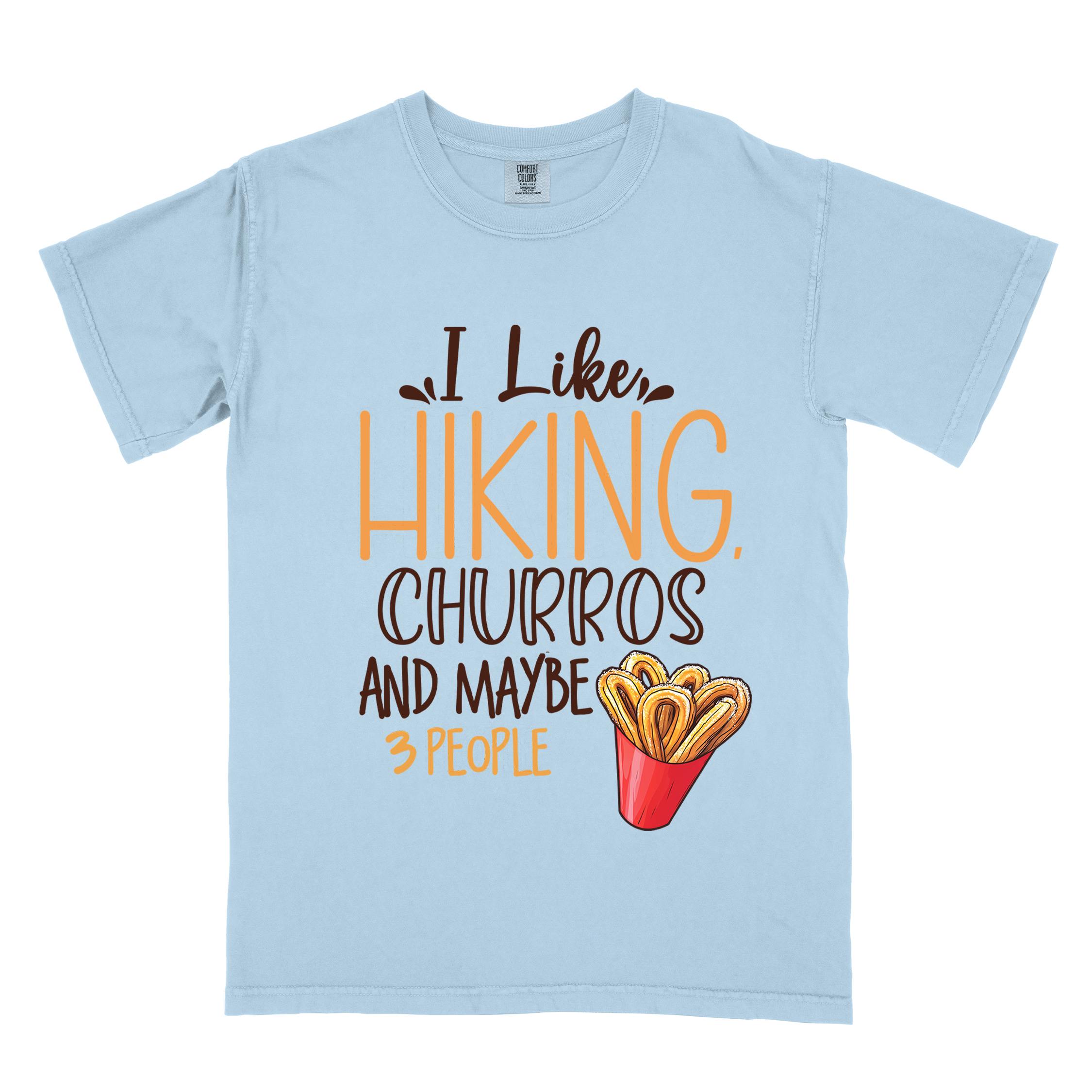 Chambray "I like hiking, churros and maybe three people " colored vintage tee with bold typography, mountains, illustrated a serving of Churros, and backpackers with a sweet tooth.