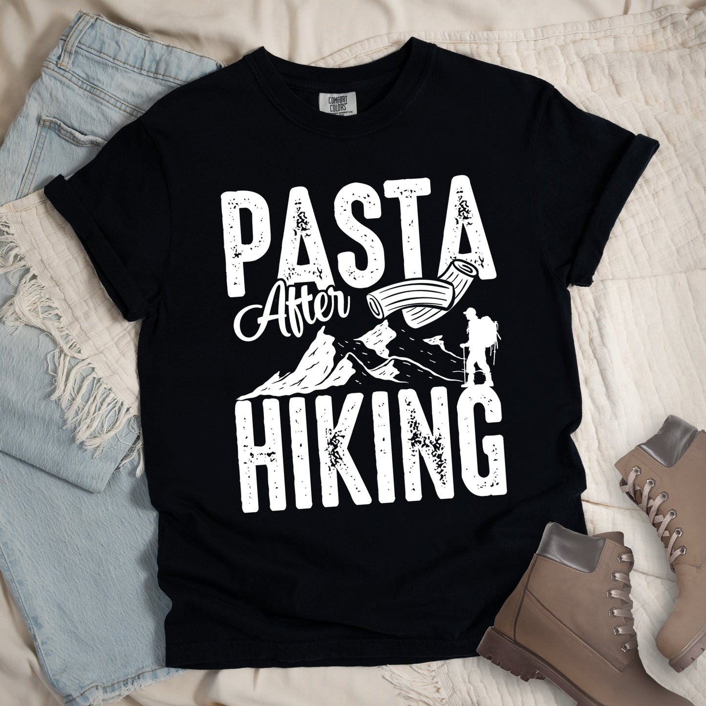 Black shirt with the phrase “Pasta After Hiking.” Includes a hiker silhouette, mountain outline, and pasta noodle illustration.