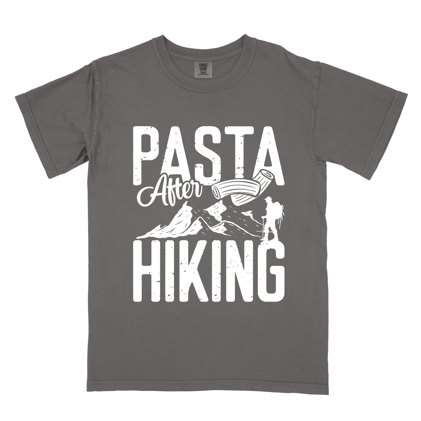Pepper (Dark Gray) t-shirt with white distressed text reading "PASTA After HIKING". "PASTA" appears in large block letters at the top, "After" in script in the middle, and "HIKING" in large block letters at the bottom. Features white mountain silhouettes in the center, a white hiker silhouette on the right side, and an illustration of penne pasta above the mountains.