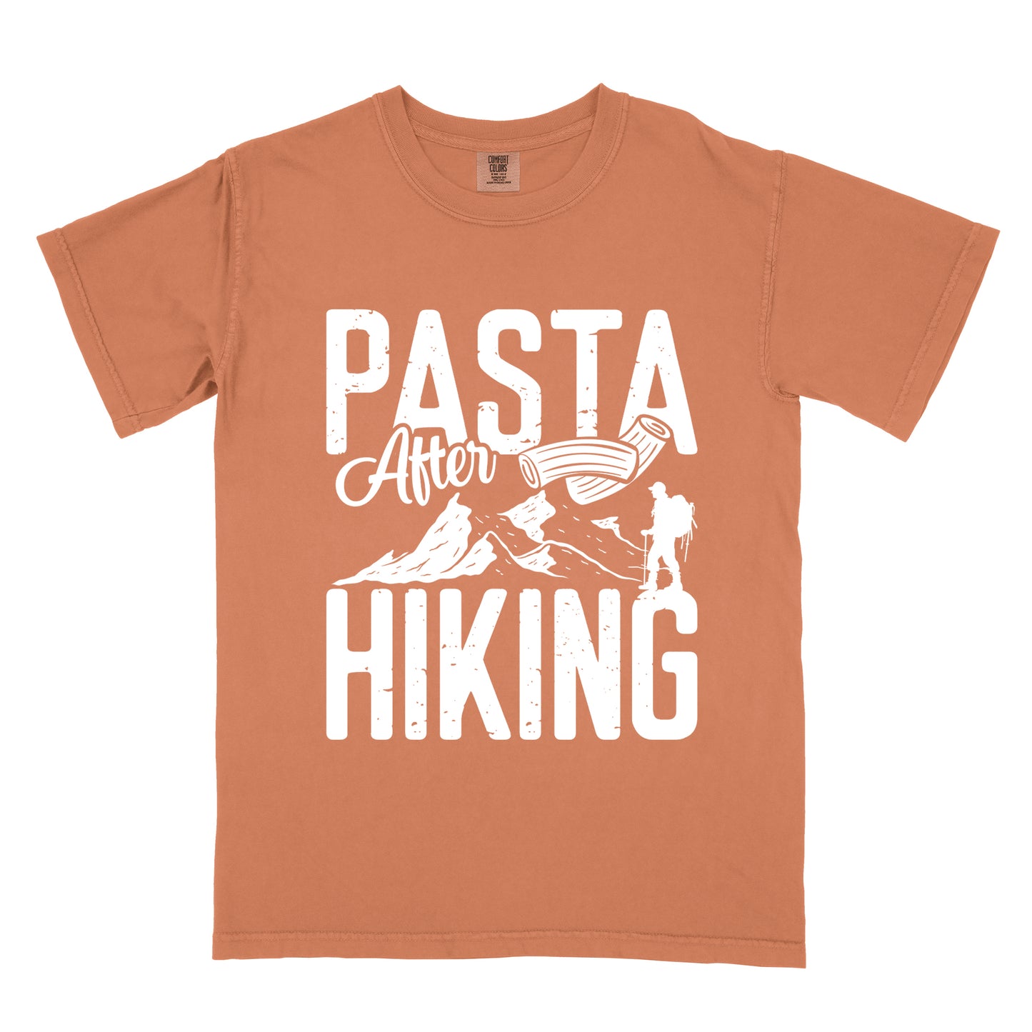 Yam (Brown) t-shirt with white distressed text reading "PASTA After HIKING". "PASTA" appears in large block letters at the top, "After" in script in the middle, and "HIKING" in large block letters at the bottom. Features white mountain silhouettes in the center, a white hiker silhouette on the right side, and an illustration of penne pasta above the mountains.