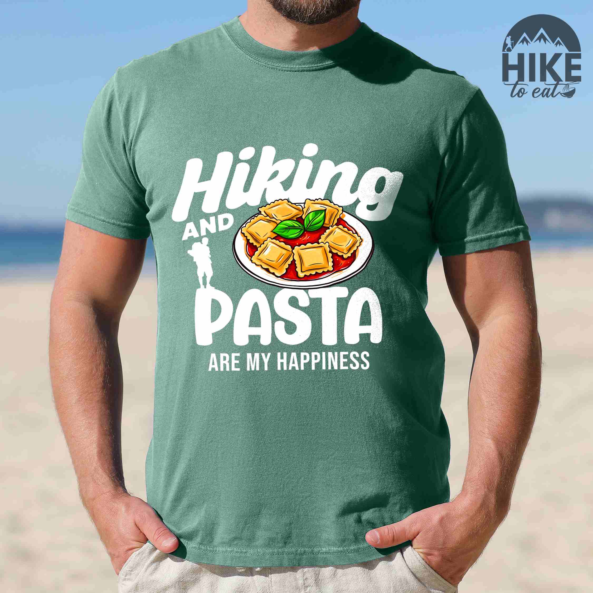 Man wearing light green "Hiking and pasta are my happiness" colored vintage tee with bold typography, illustrated plate of pasta, and backpackers for pasta lovers.