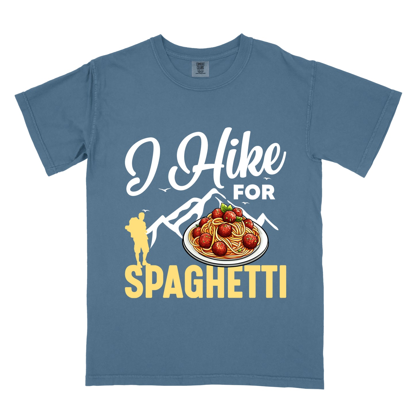 Blue Jean (Denim Blue) t-shirt with white and yellow text reading "I Hike FOR SPAGHETTI". "I Hike" appears in white script at the top, "FOR" in white uppercase text, and "SPAGHETTI" in large yellow letters at the bottom. Features white mountain silhouettes with small birds, a yellow hiker silhouette on the left, and a detailed illustration of spaghetti with meatballs and basil on a white plate.