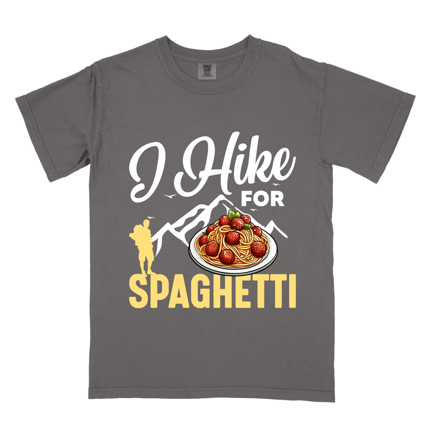Pepper (Dark Gray) t-shirt with white and yellow text reading "I Hike FOR SPAGHETTI". "I Hike" appears in white script at the top, "FOR" in white uppercase text, and "SPAGHETTI" in large yellow letters at the bottom. Features white mountain silhouettes with small birds, a yellow hiker silhouette on the left, and a detailed illustration of spaghetti with meatballs and basil on a white plate.