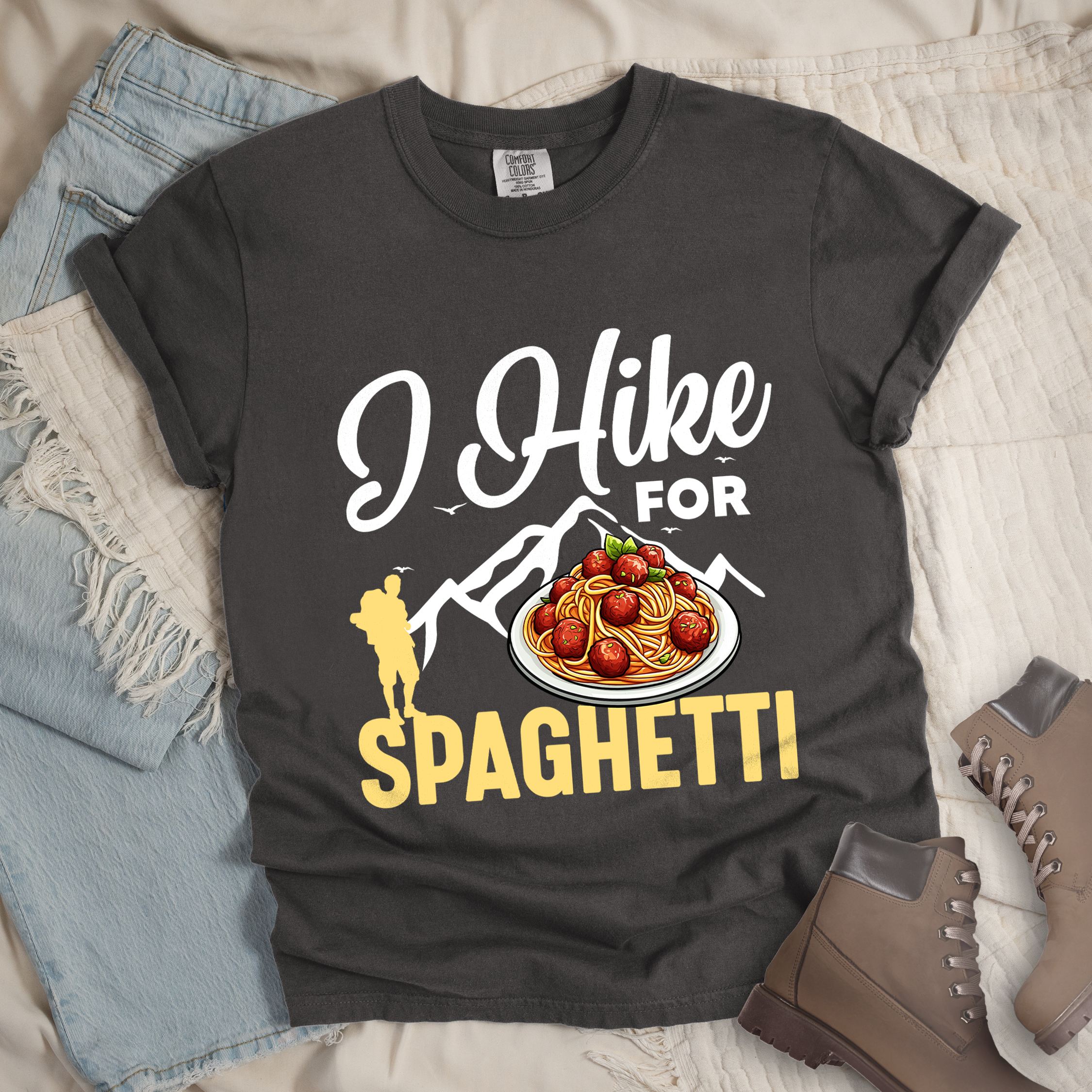 Dark grey shirt with the phrase “I Hike For Spaghetti.” Includes a hiker silhouette, mountain outline, and a plate of spaghetti with meatballs.