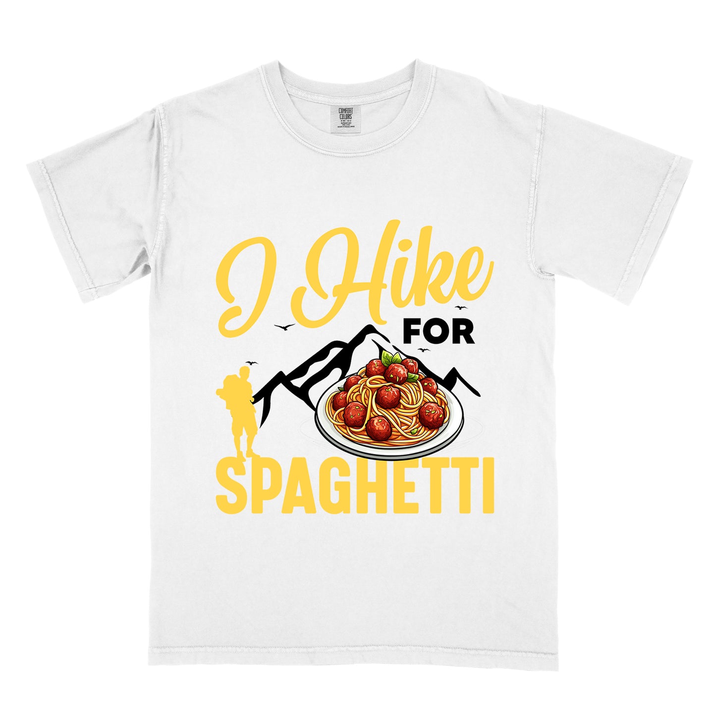 White t-shirt with black and yellow text reading "I Hike FOR SPAGHETTI". "I Hike" appears in yellow script at the top, "FOR" in black uppercase text, and "SPAGHETTI" in large yellow letters at the bottom. Features black mountain silhouettes with small birds, a yellow hiker silhouette on the left, and a detailed illustration of spaghetti with meatballs and basil on a white plate.