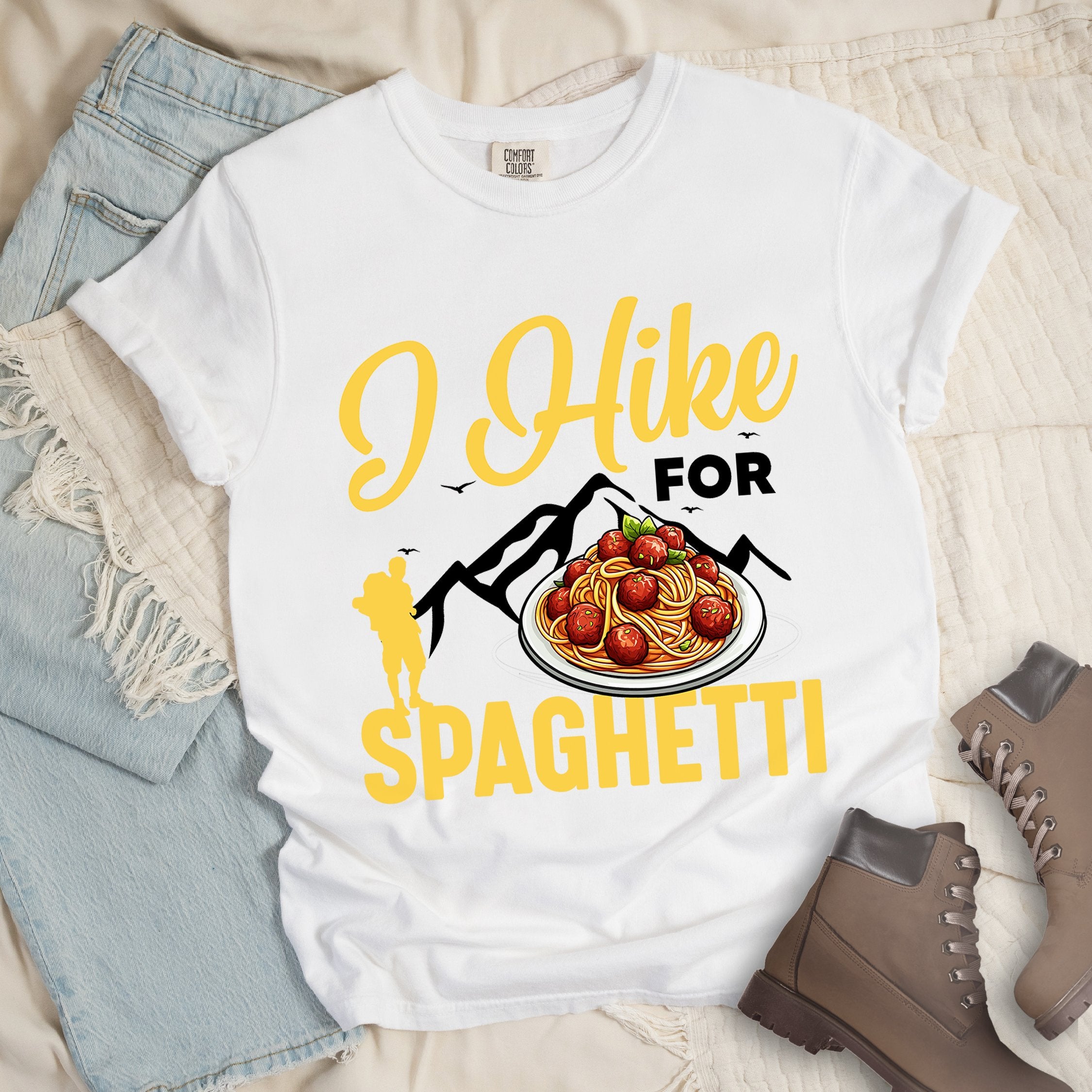 White shirt with the phrase “I Hike For Spaghetti.” Includes a hiker silhouette, mountain outline, and a plate of spaghetti with meatballs.