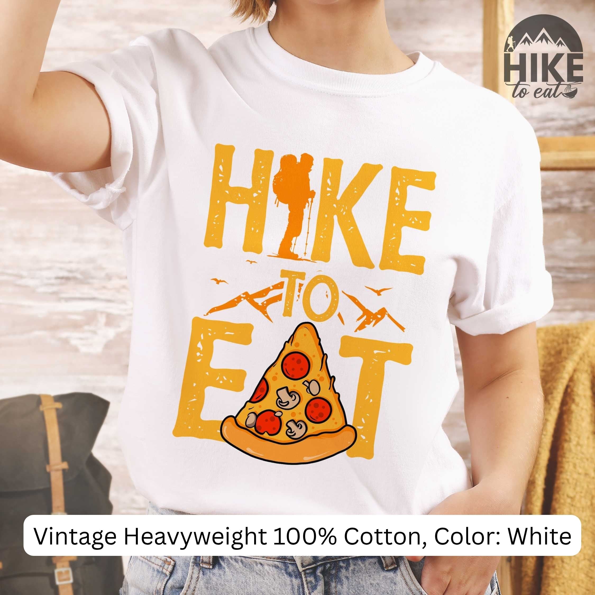 White t-shirt with 'Hike to Eat' pizza graphic and 'Hike to Eat' branding. vintage Heavyweight 100% cotton, color: white. 