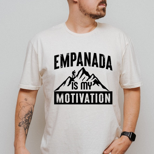 man wearing a beige Empanada is my Motivation statement t-shirt with bold distressed typography, mountain peaks, and hiker silhouette for empanada lovers and outdoor enthusiasts on Softstyle 100% cotton