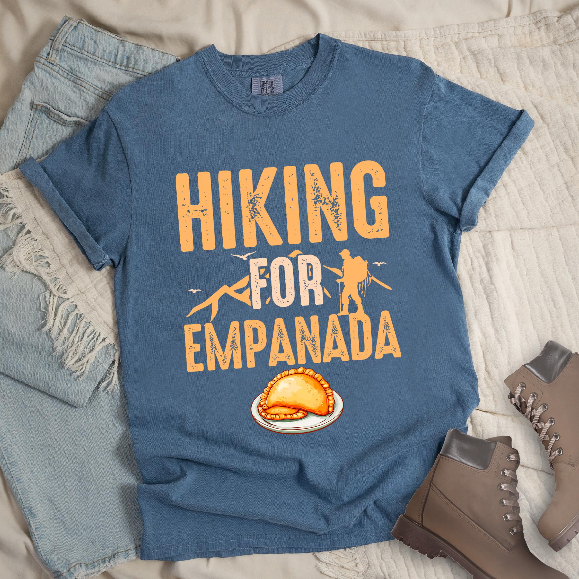 Dark blue shirt with Hiking Design featuring the phrase “Hiking for Empanada” and a hiker silhouette with mountains and a plate of empanada.