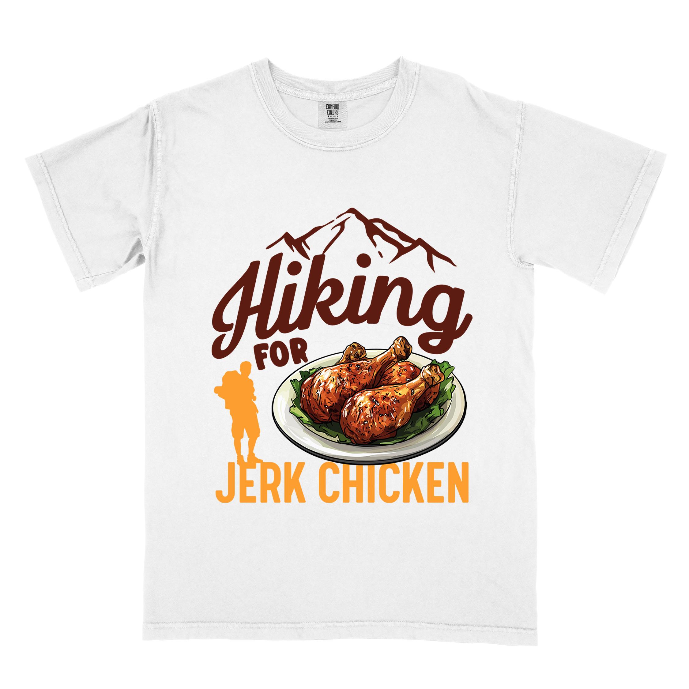 White "hiking for jerk chicken" colored vintage tee with bold typography, illustrated jerk chicken on a plate, mountains, birds, and backpackers for bbq chicken lovers.