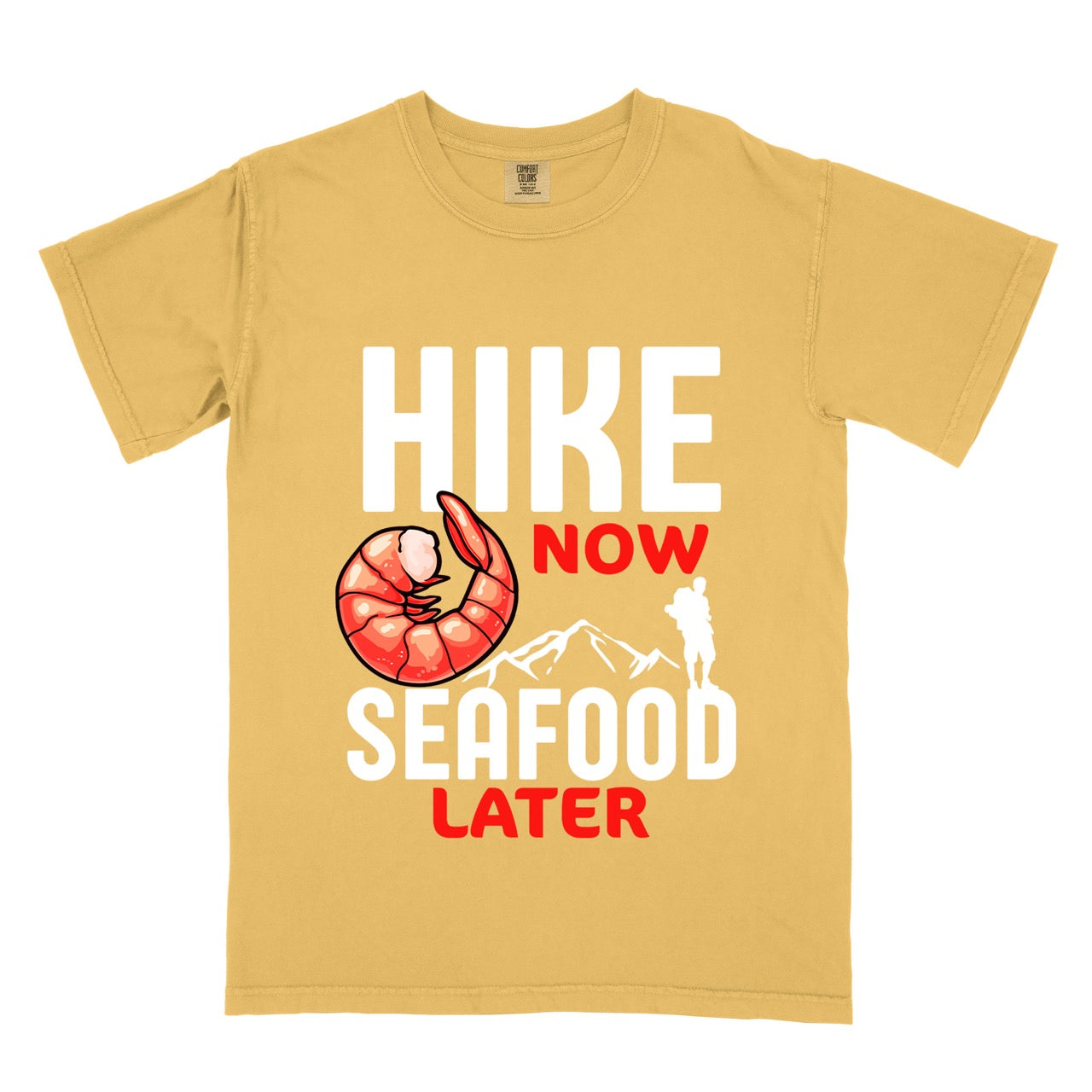 Funny hiking motivation shirt for seafood lovers featuring bold NOW LATER typography, realistic shrimp graphic, mountain landscape illustration, and hiker silhouette on premium outdoor adventure tee perfect gift for trail enthusiasts who love fresh ocean food in mustard