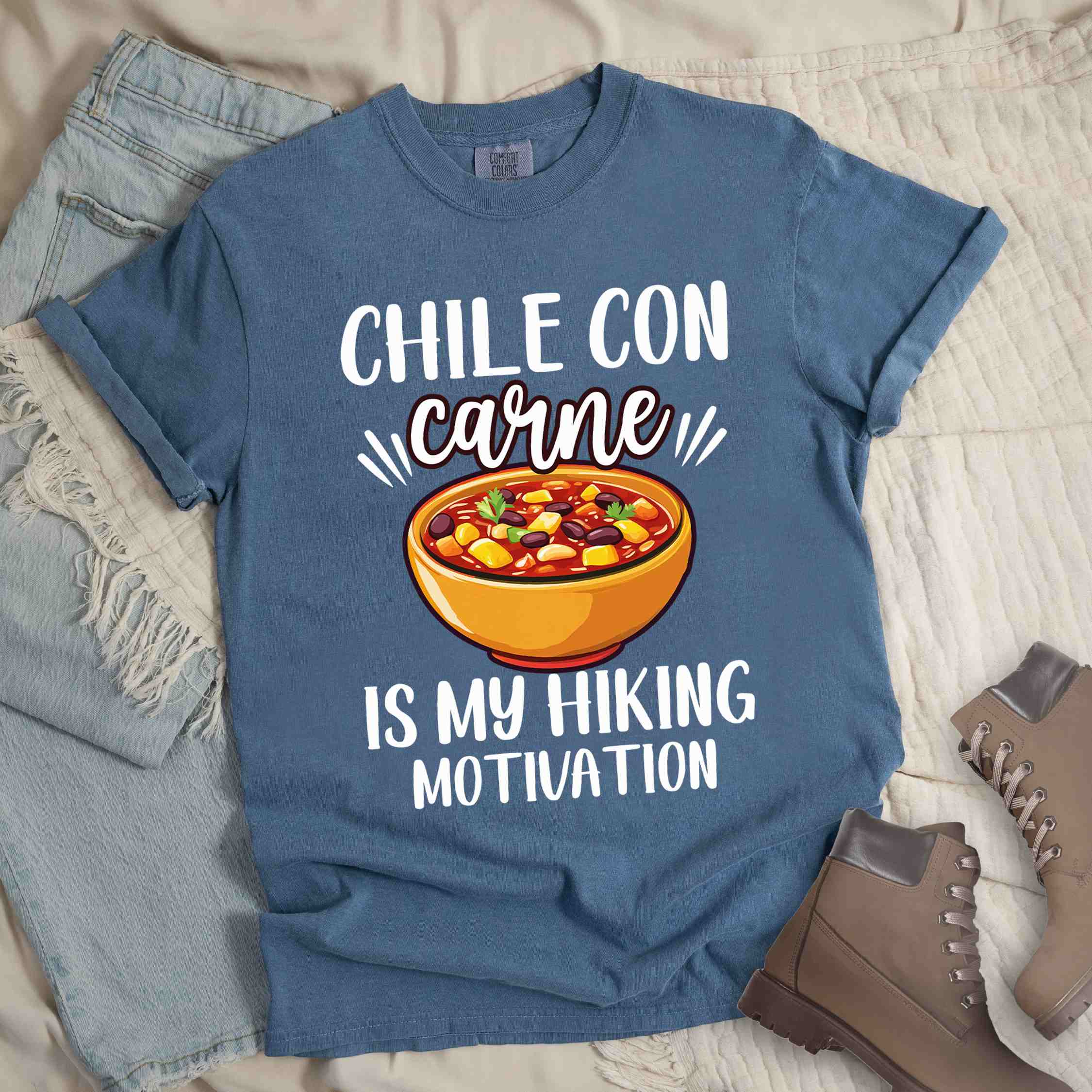 Blue jean Chile con carne is my Hiking Motivation statement tee with bold typography, script lettering, and colorful chili bowl illustration for comfort food-loving outdoor enthusiasts