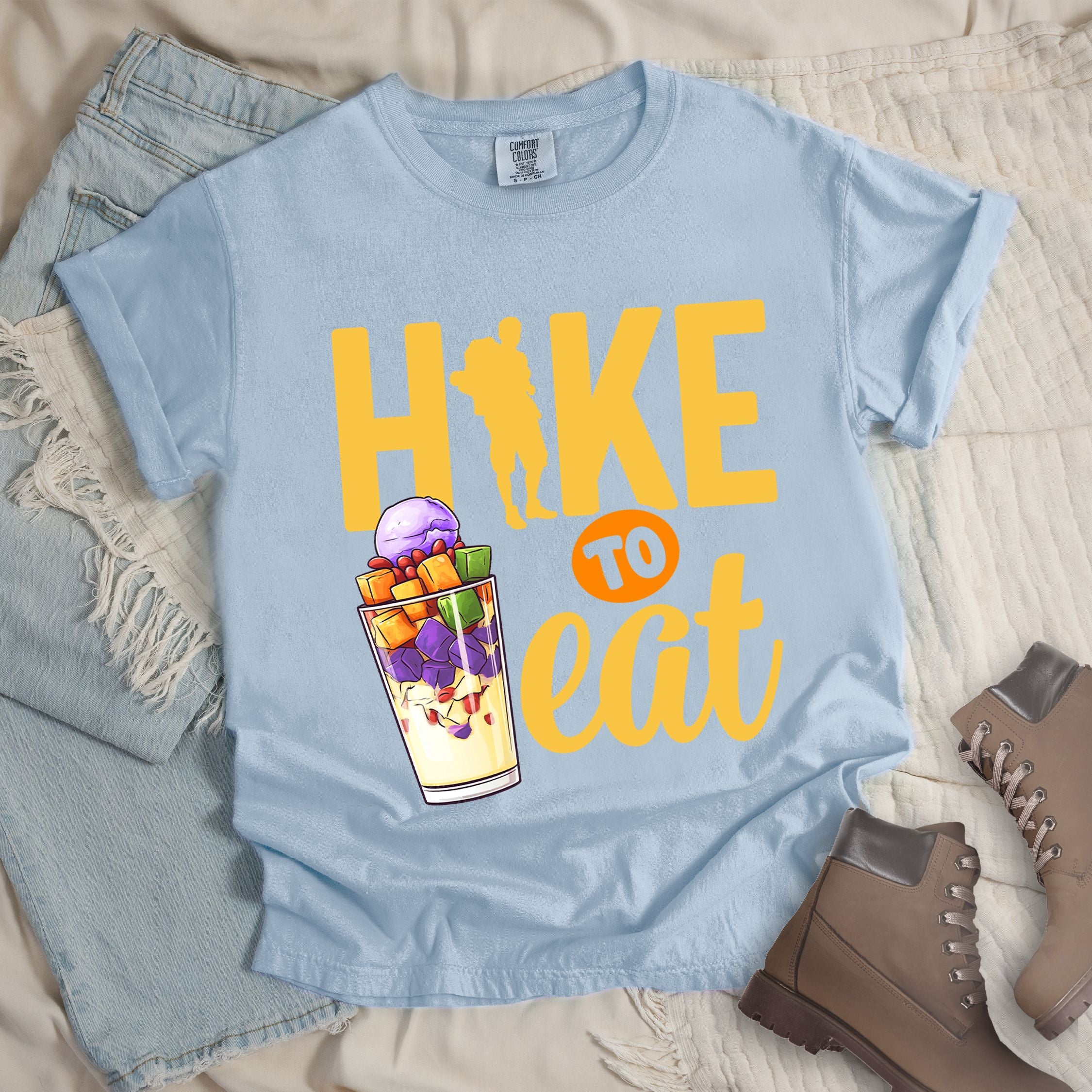 Light blue shirt with Hiking Design featuring the phrase “Hike to Eat” and an illustration of halo-halo dessert in a tall glass.