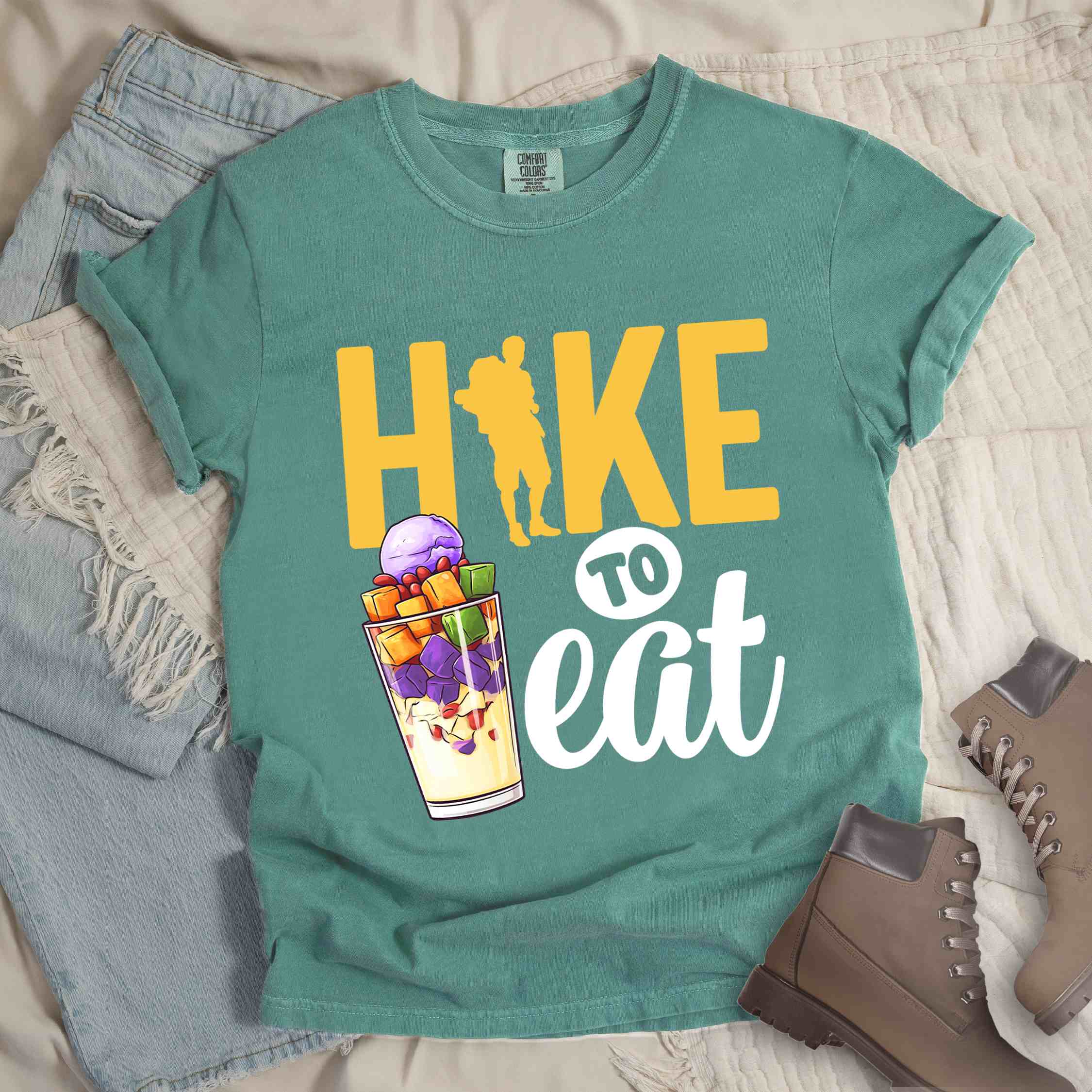 Light green "hike to eat" colored vintage tee with bold typography, illustrated halo-halo dessert, and backpackers for iced dessert lovers.